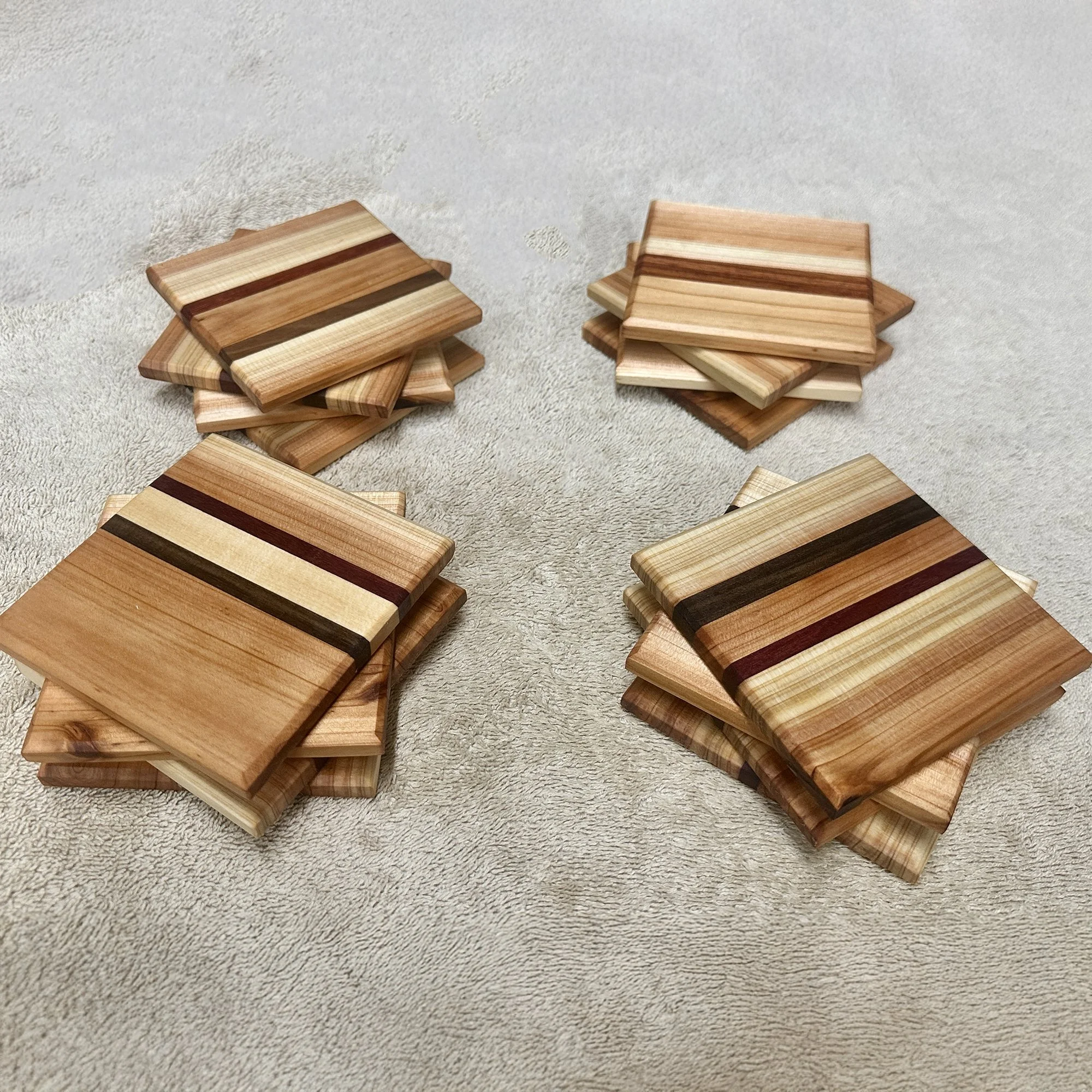 Mixed wood coasters in cutting board style.