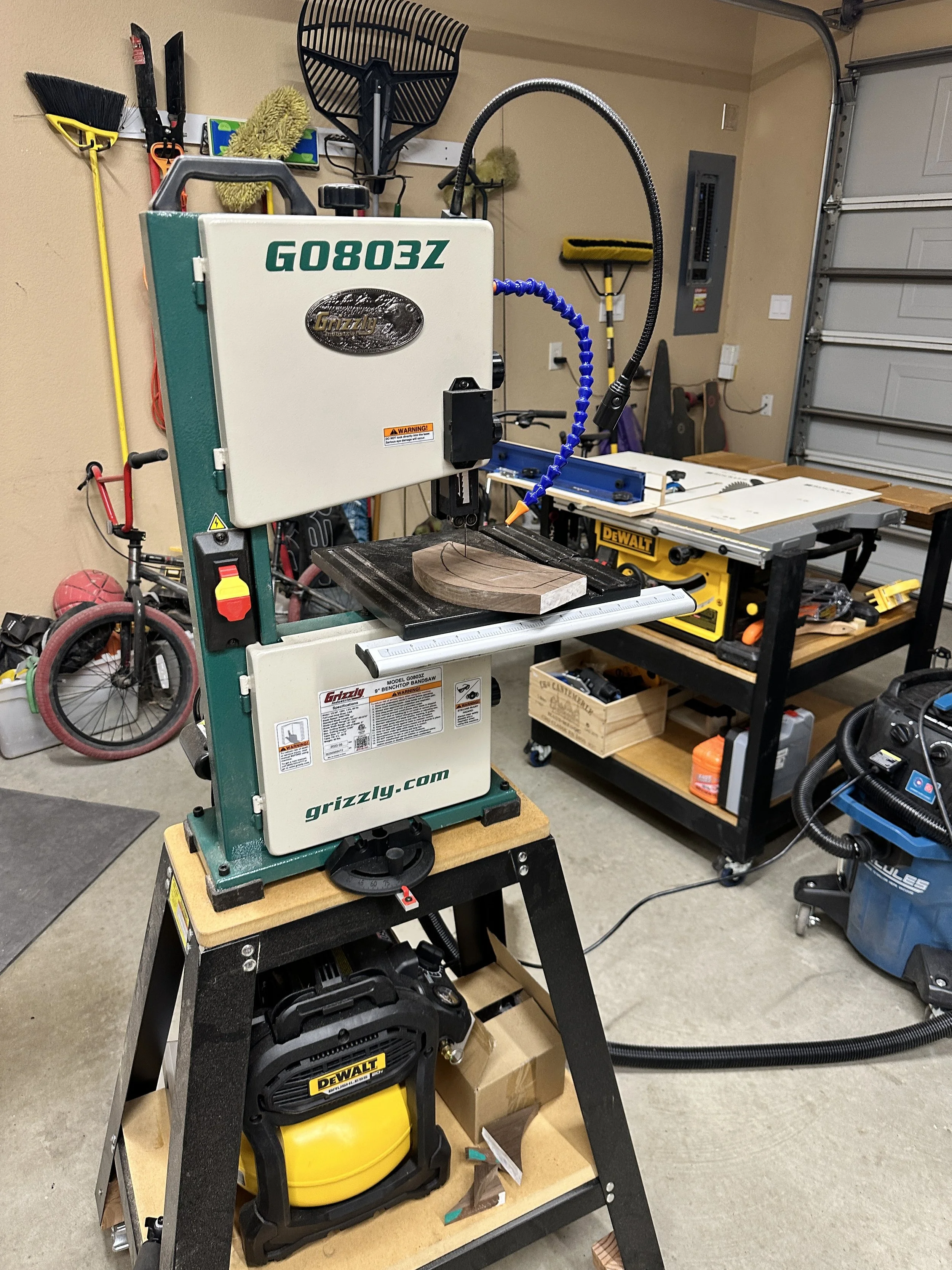 Grizzly bandsaw mounted on a portable stand.