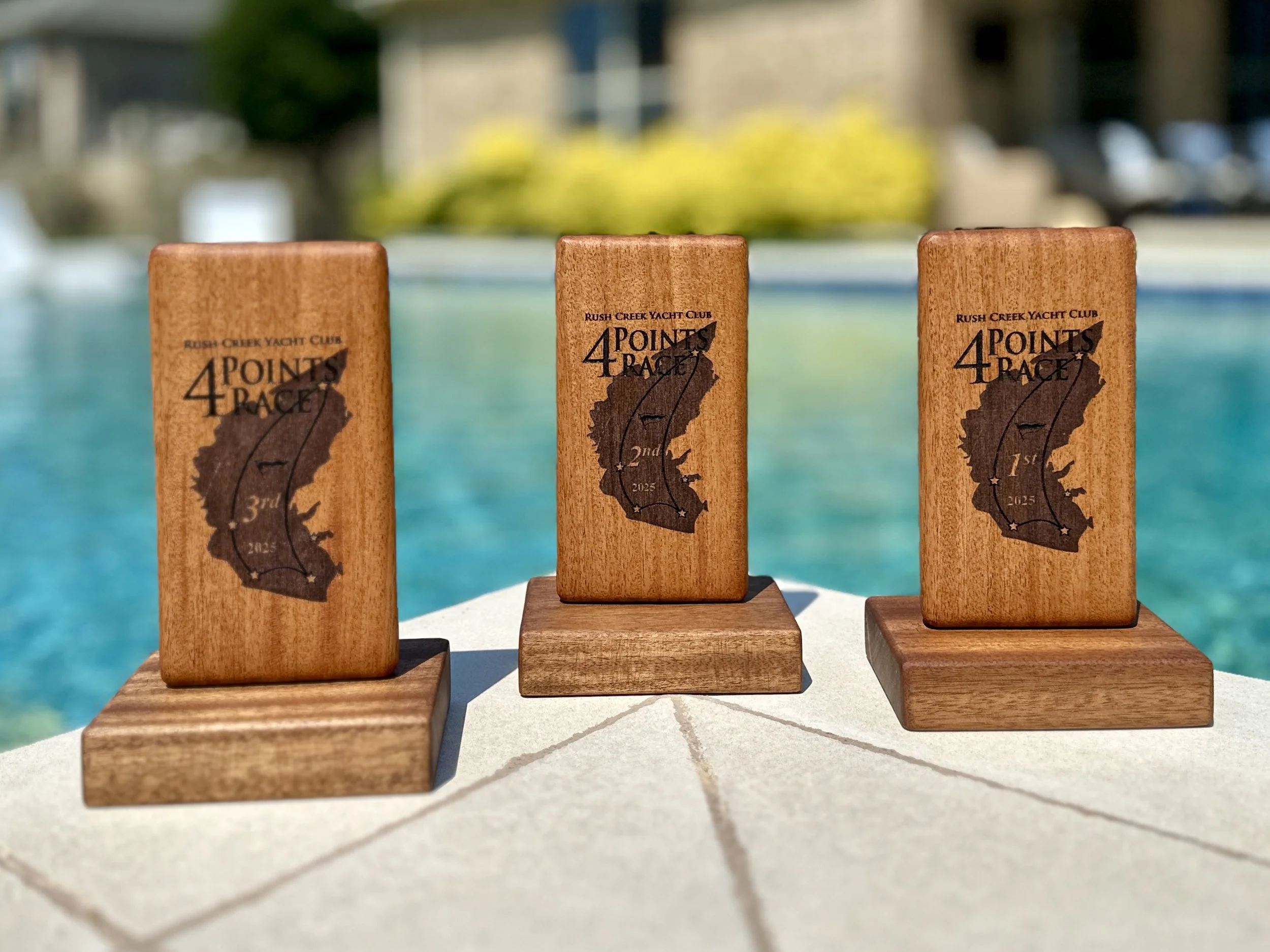 Custom wooden sailing trophies made for the Rush Creek Yacht Club's 4-Points Race. Constructed from Mahogany and African Edinam. Designed in a "Floating" style with biscuit joinery.