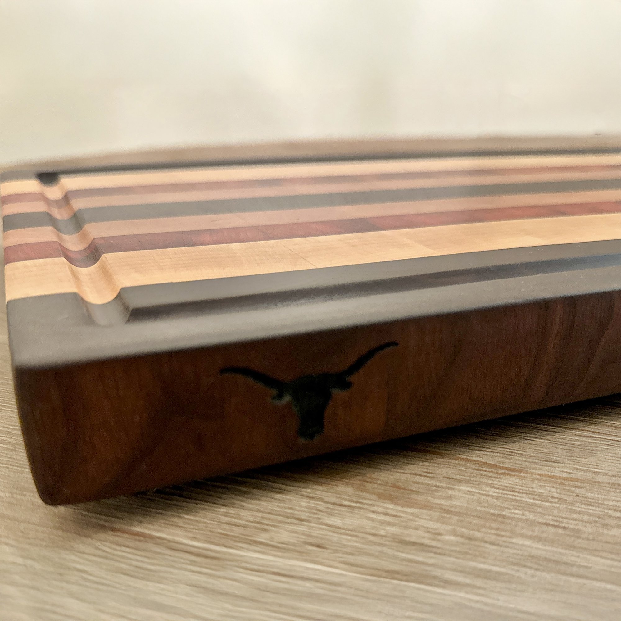 End Grain Cutting Board with the Longhorn lgogo engraved on the edge.