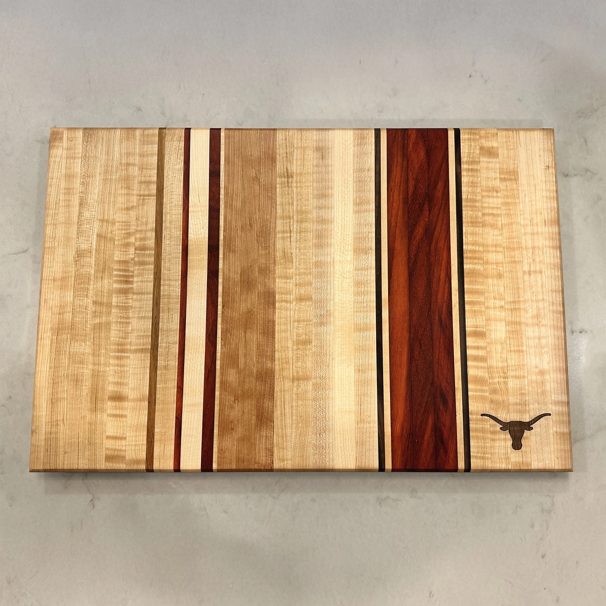 Large Hardwood Edge Grain cutting board with decorative stripes, featuring the Longhorn logo. - 22 x 14 x 1.25.