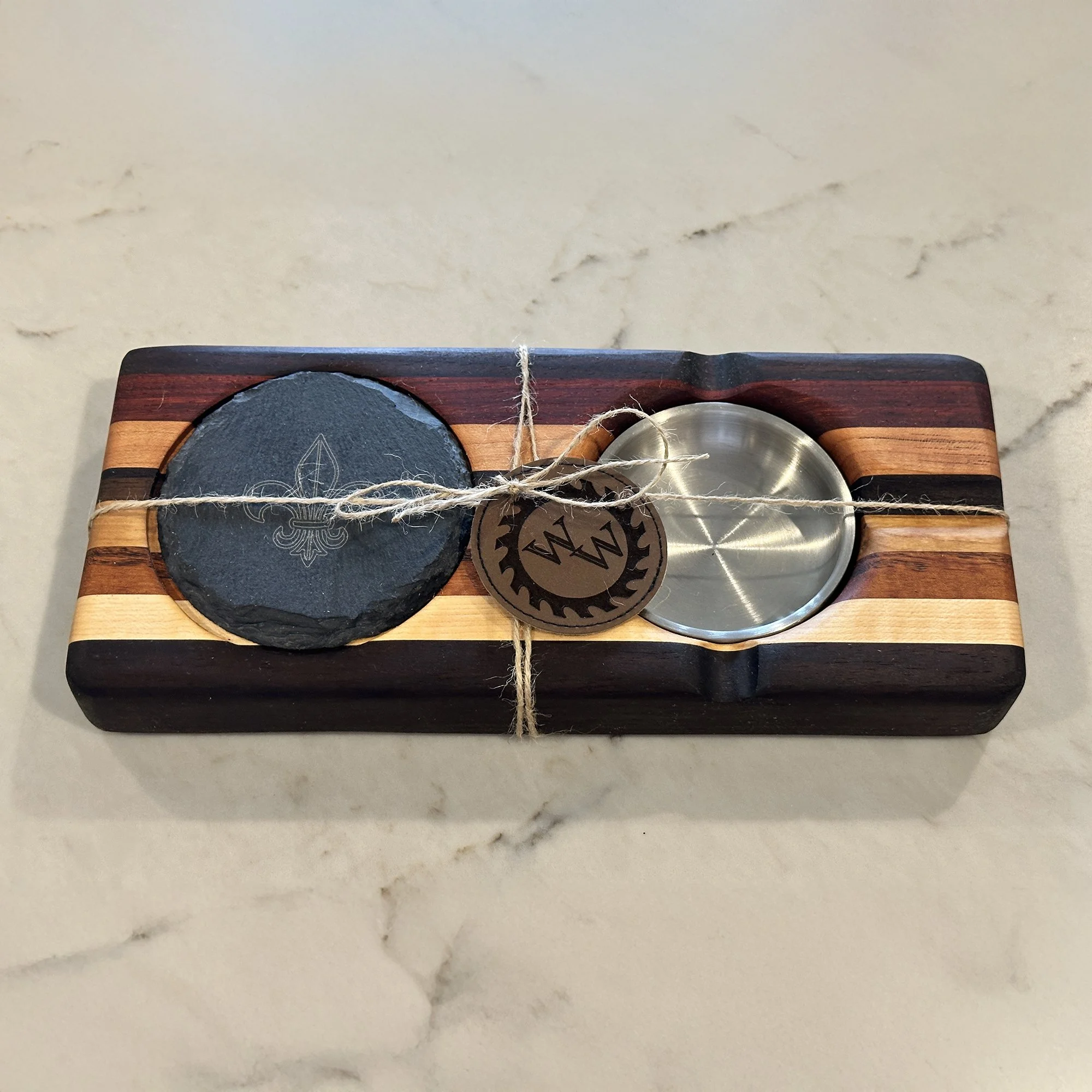 Cigar center designed for enjoying on your patio, branded with the ubiquitous fleur-de-lis, representing all things Southern Louisiana.