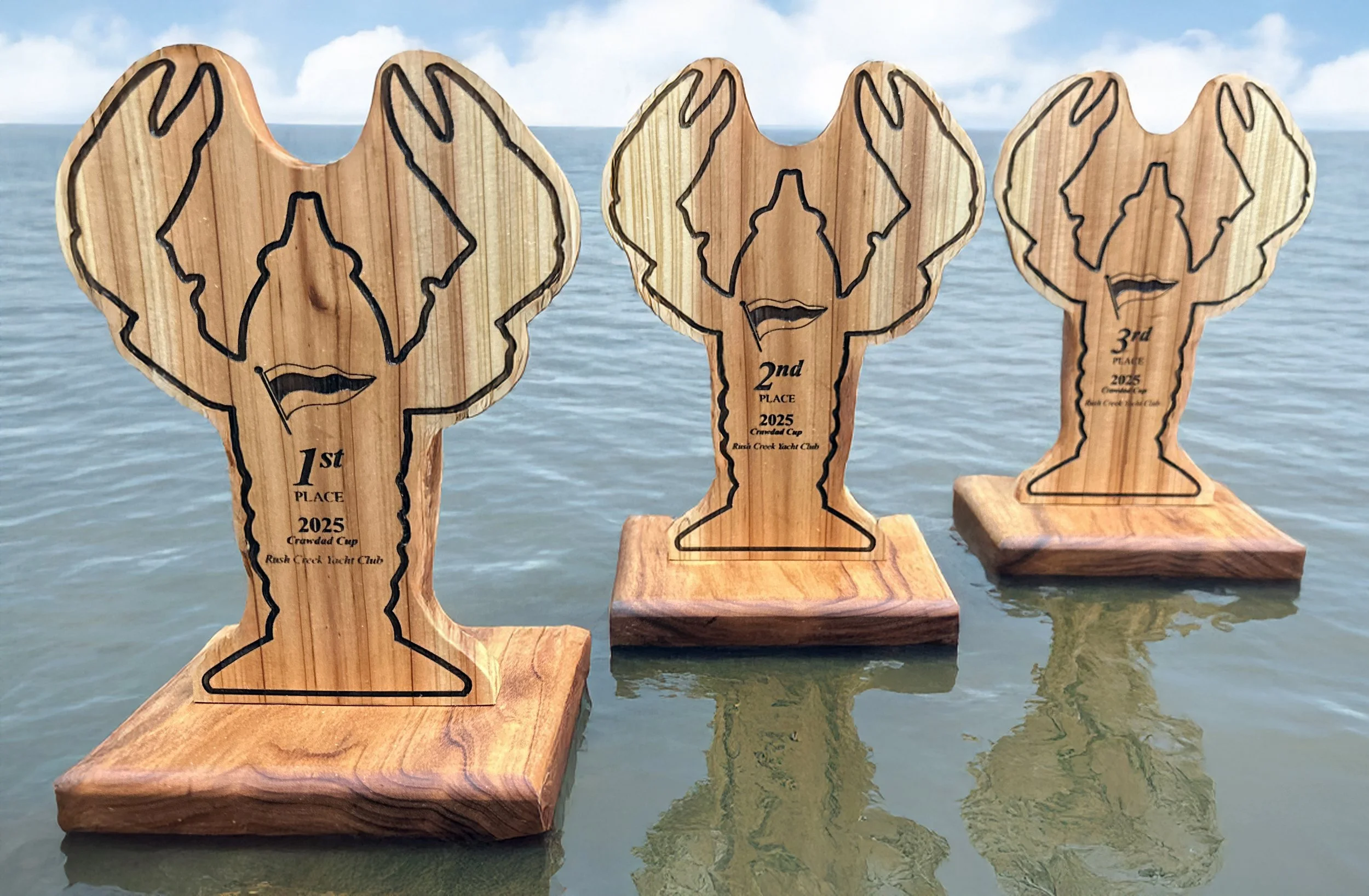 Custom sailing long-distance race trophies crafted from Aromic Cedear and Monkeypod.