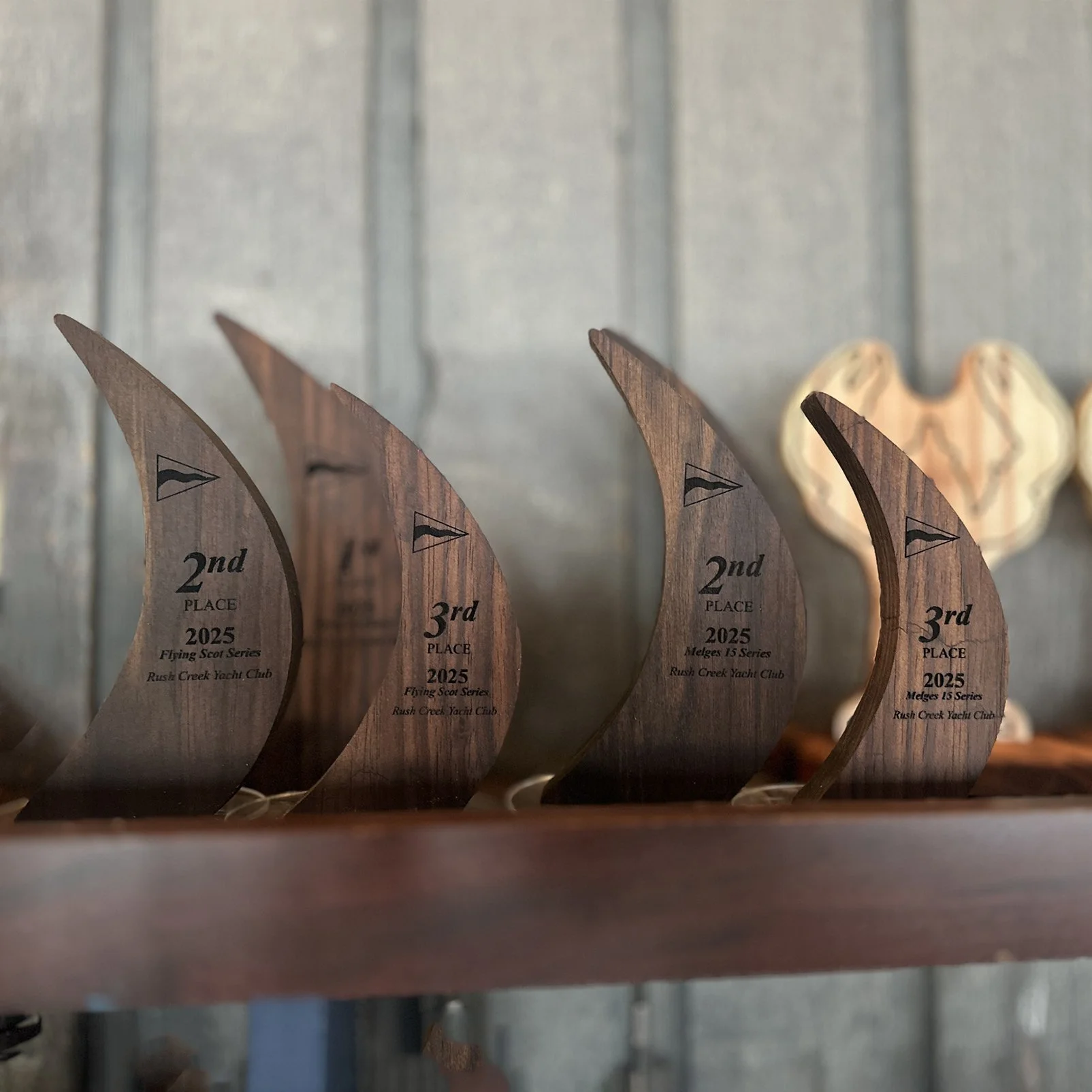 Wooden sailing trophies from Walnut, mounted on a 3" acrylic disc.