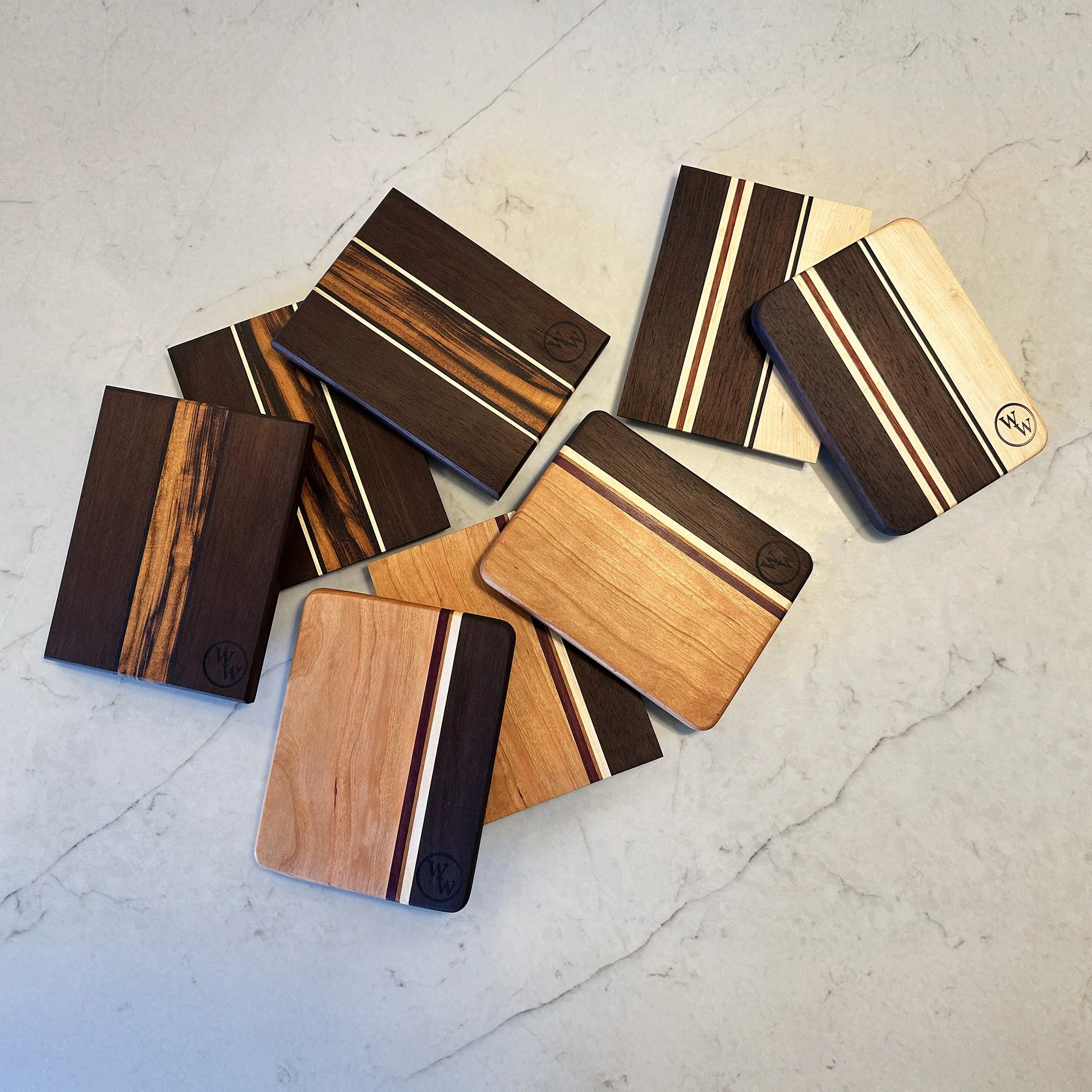 Eight Hardwood Cheese boards with various striped designs. 7-1/2 x 5-1/4 x 3/4