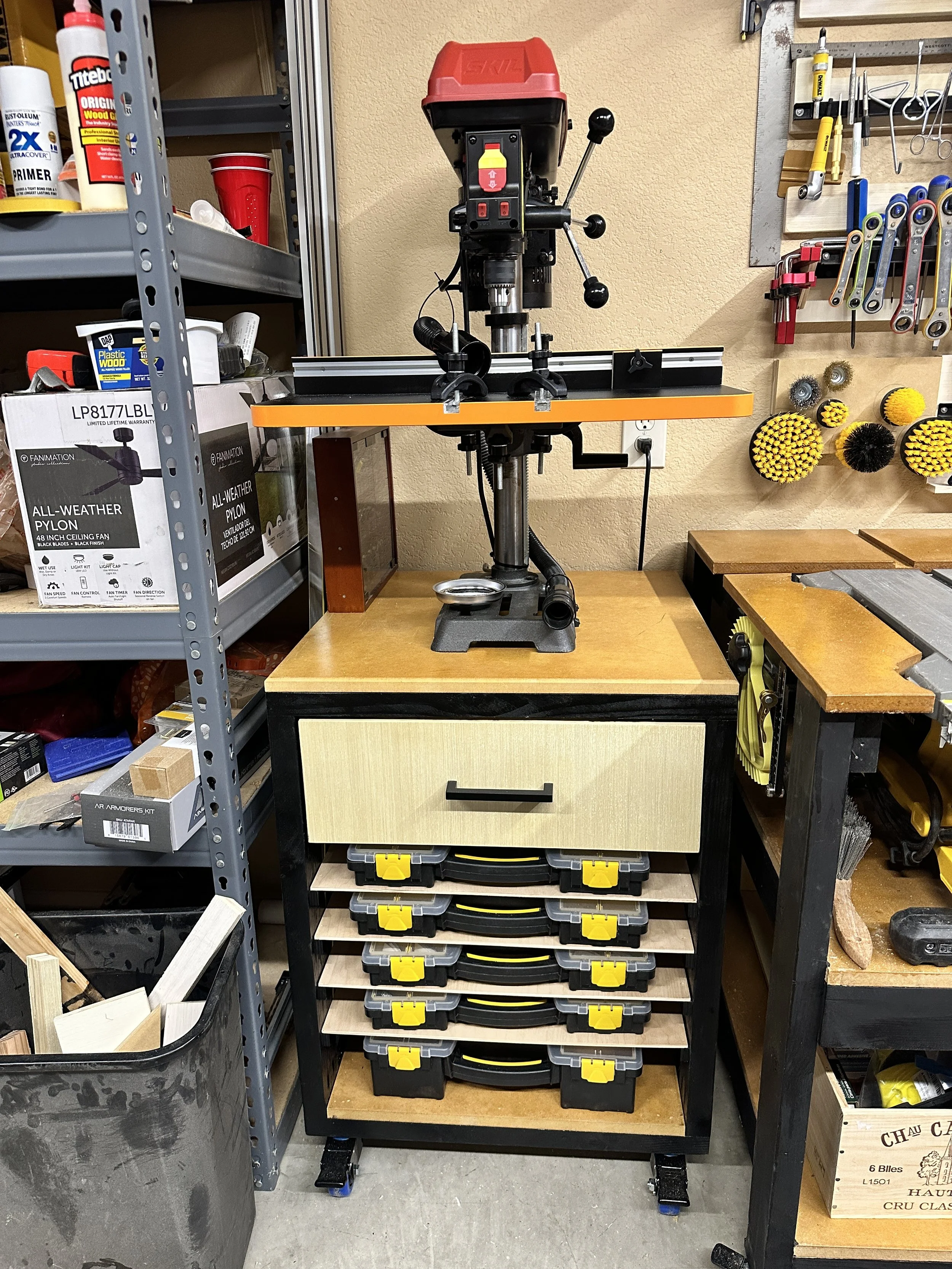 Skill Drill Press  mounted on a portable stand with compartment storage and drawer.