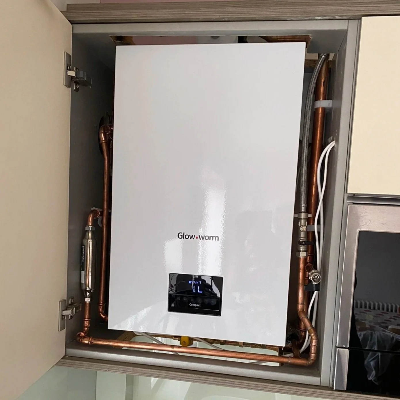 Glow Worm boiler installed in a cupboard