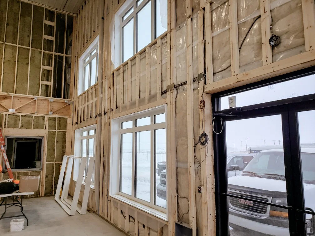 Commercial space windows with PVC Window Jamb Extensions installed