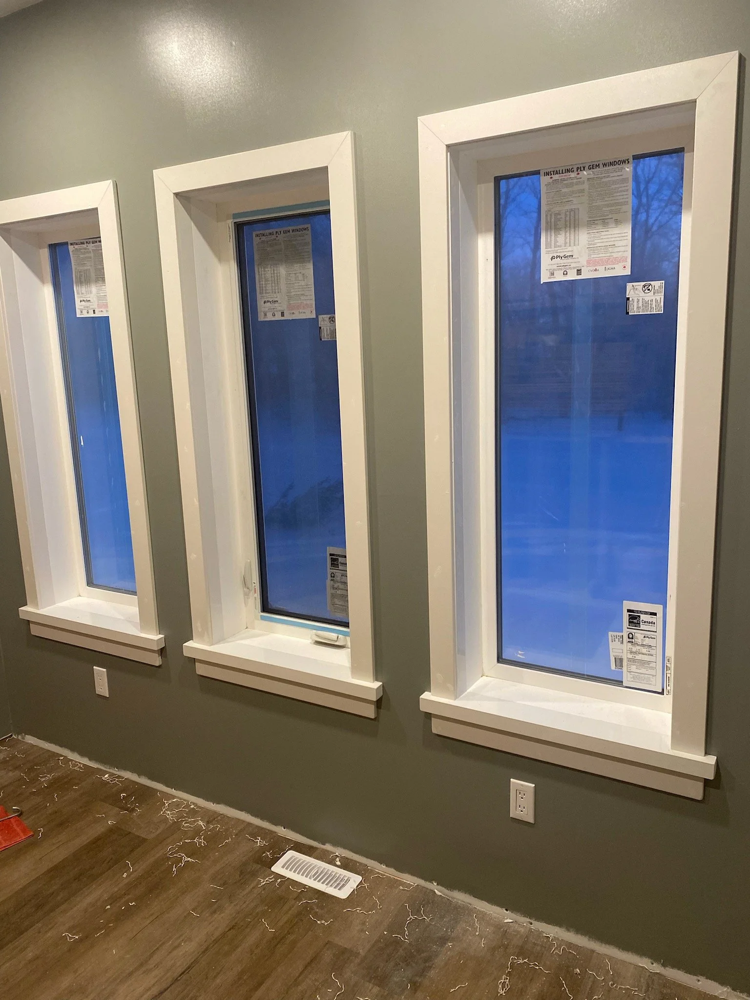 Three new window installations finished with Trim Rite Mfg. PVC Window Jamb Extensions and MDF casing.