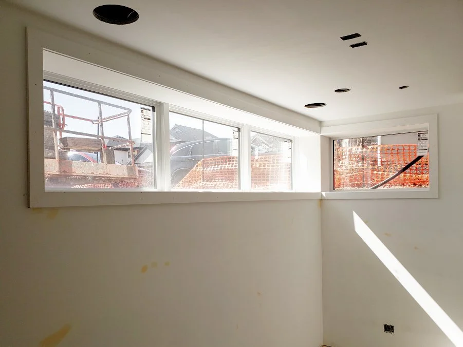Large basement corner window finished with PVC Window Jamb Extension
