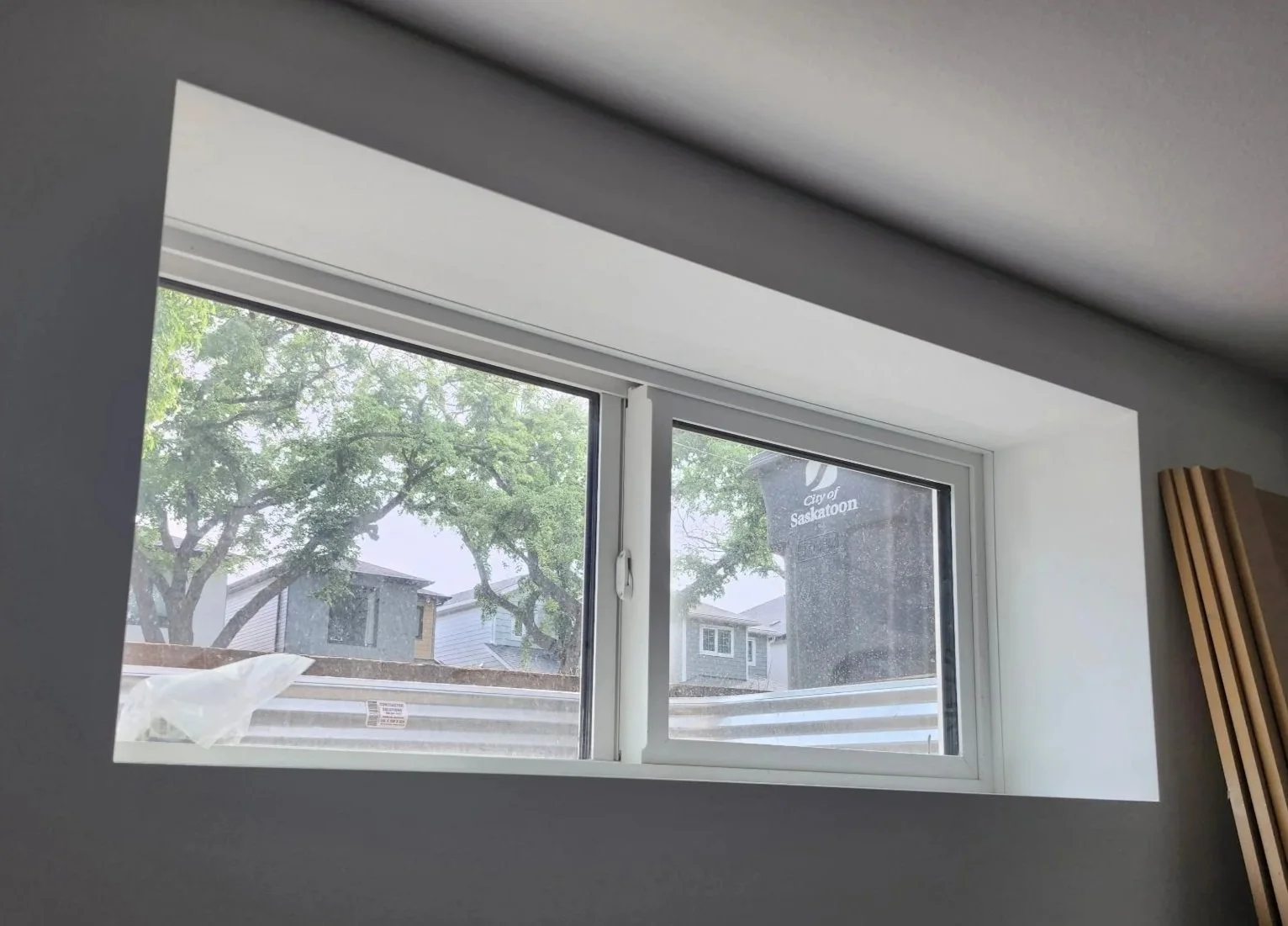 A window finished "Trimless Style" using a PVC Window Jamb Extension.