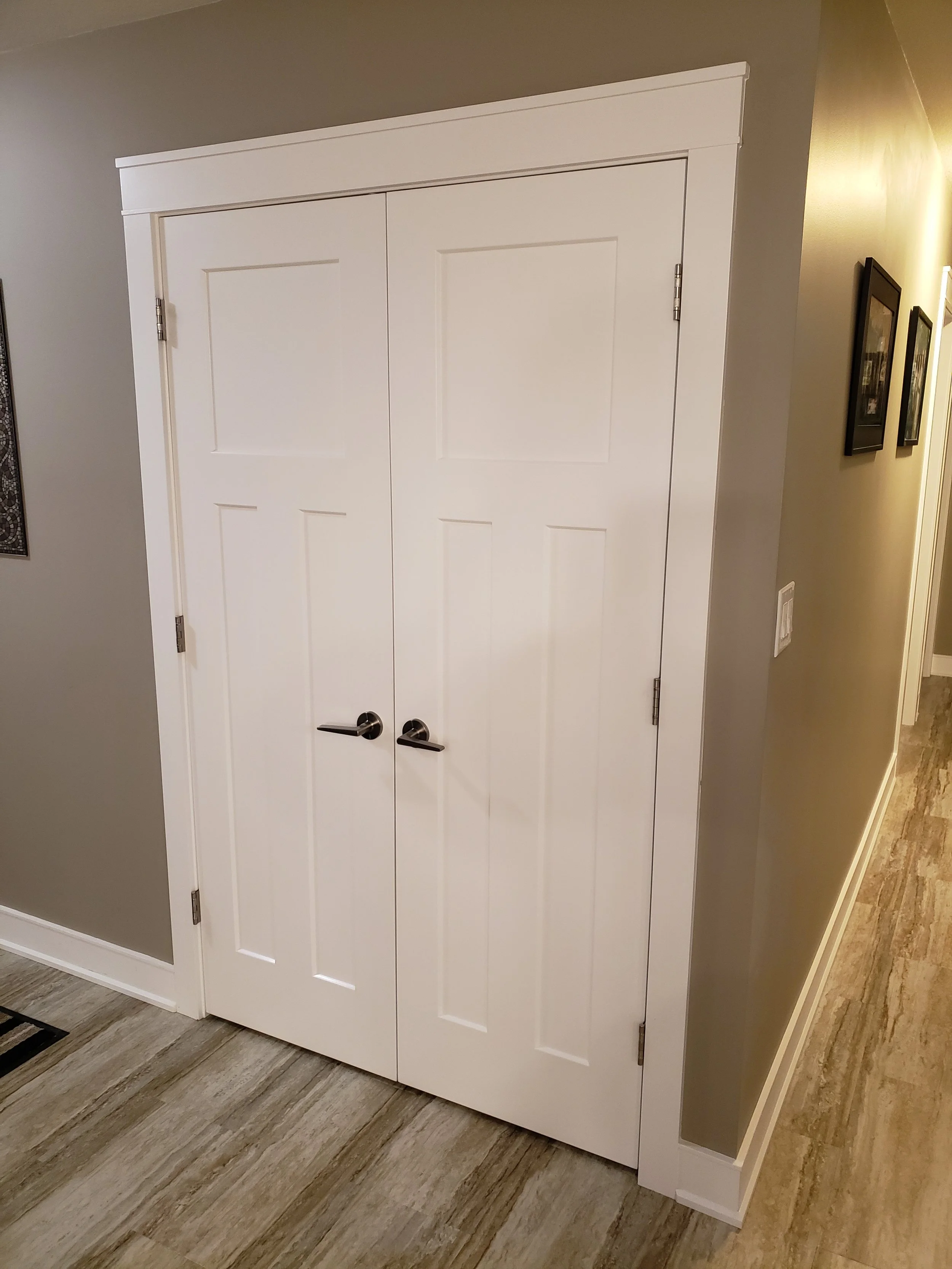 Double white interior doors finished with PVC trim from Trim Rite Mfg.