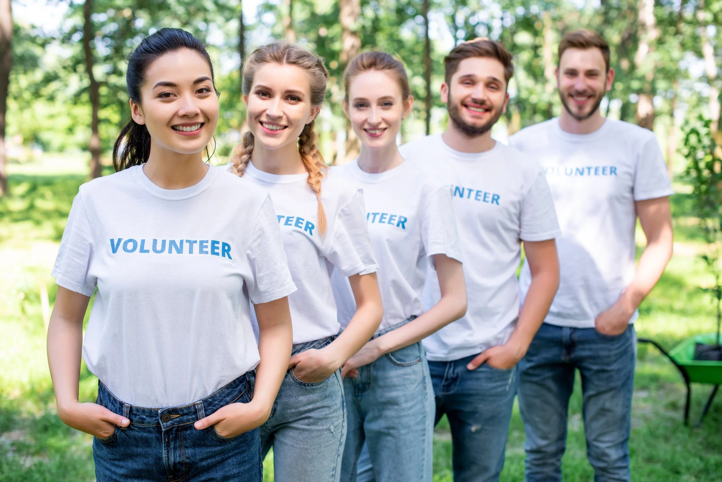 young-smiling-volunteers-standing-in-row-in-park-2026-01-06-00-37-39-utc.jpg