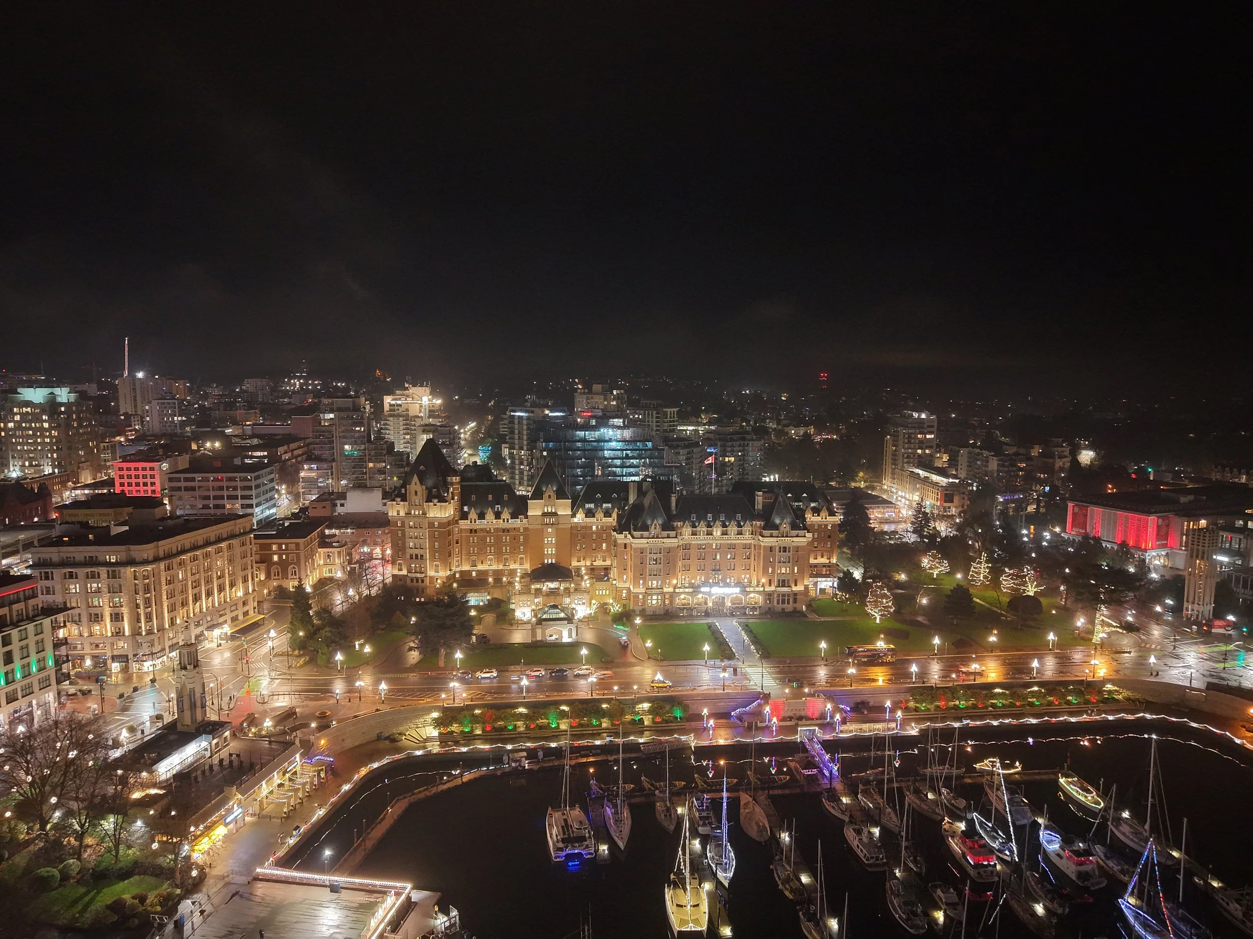 A calm, misty night over Victoria’s Inner Harbor, captured from above.
