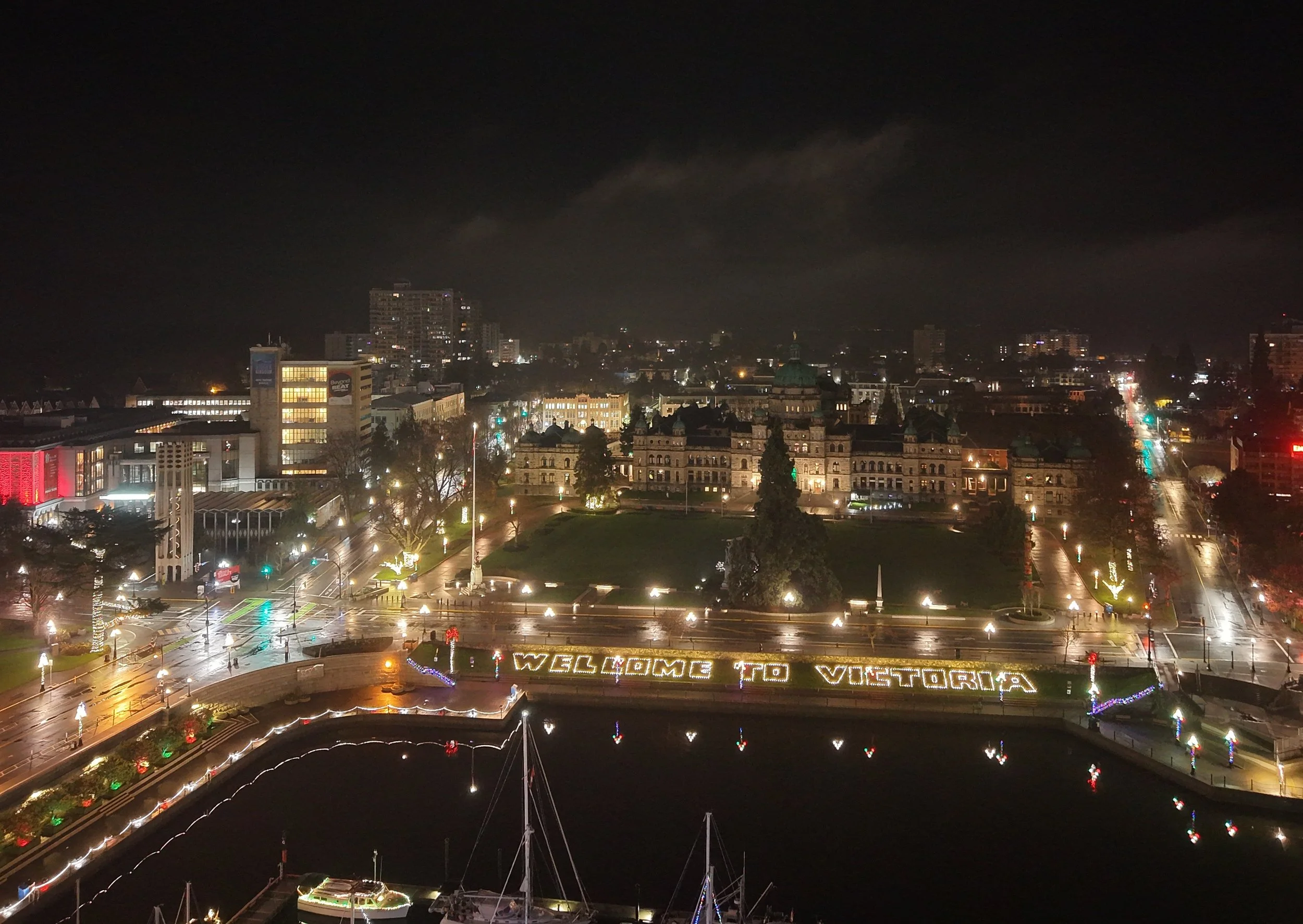 A calm, misty night over Victoria’s Inner Harbor, captured from above.