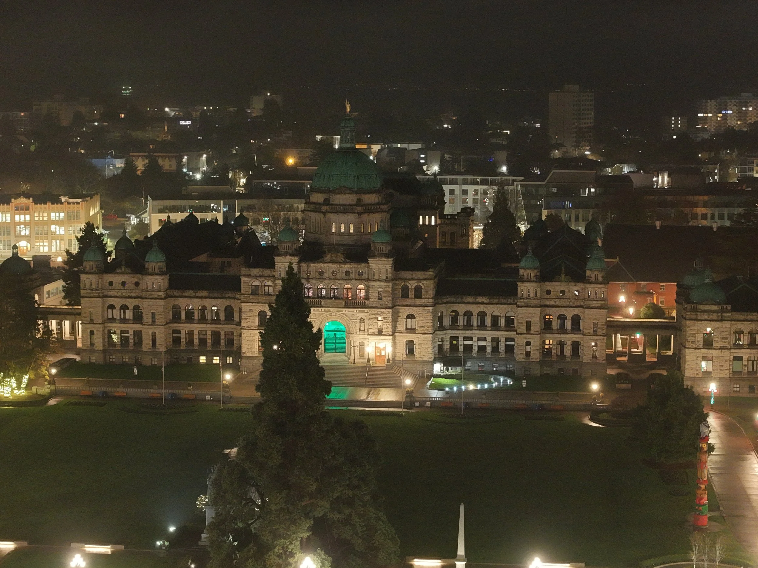 A calm, misty night over Victoria’s Inner Harbor, captured from above.