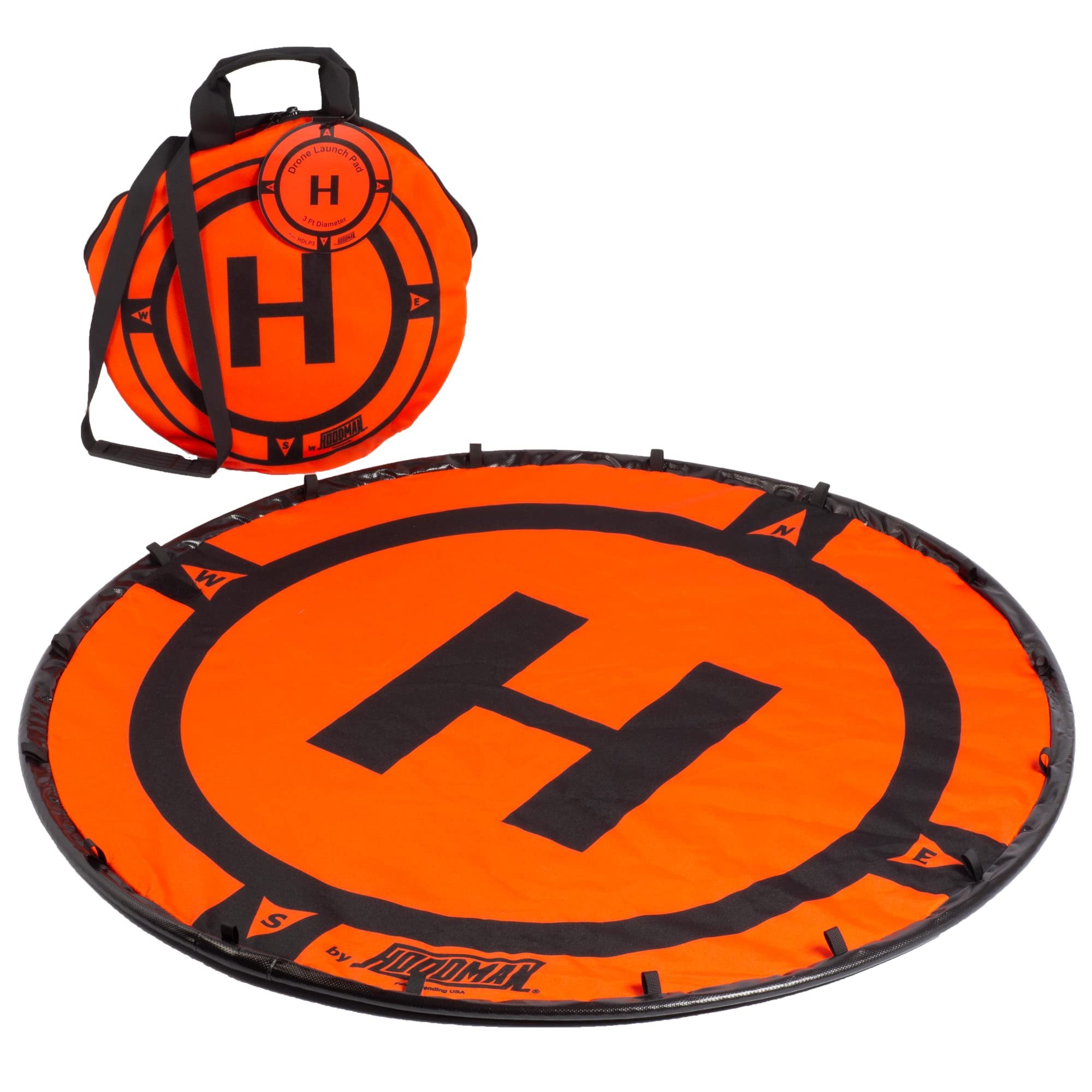 Orange and black Hoodman three-foot drone landing pad with its carrying straps.