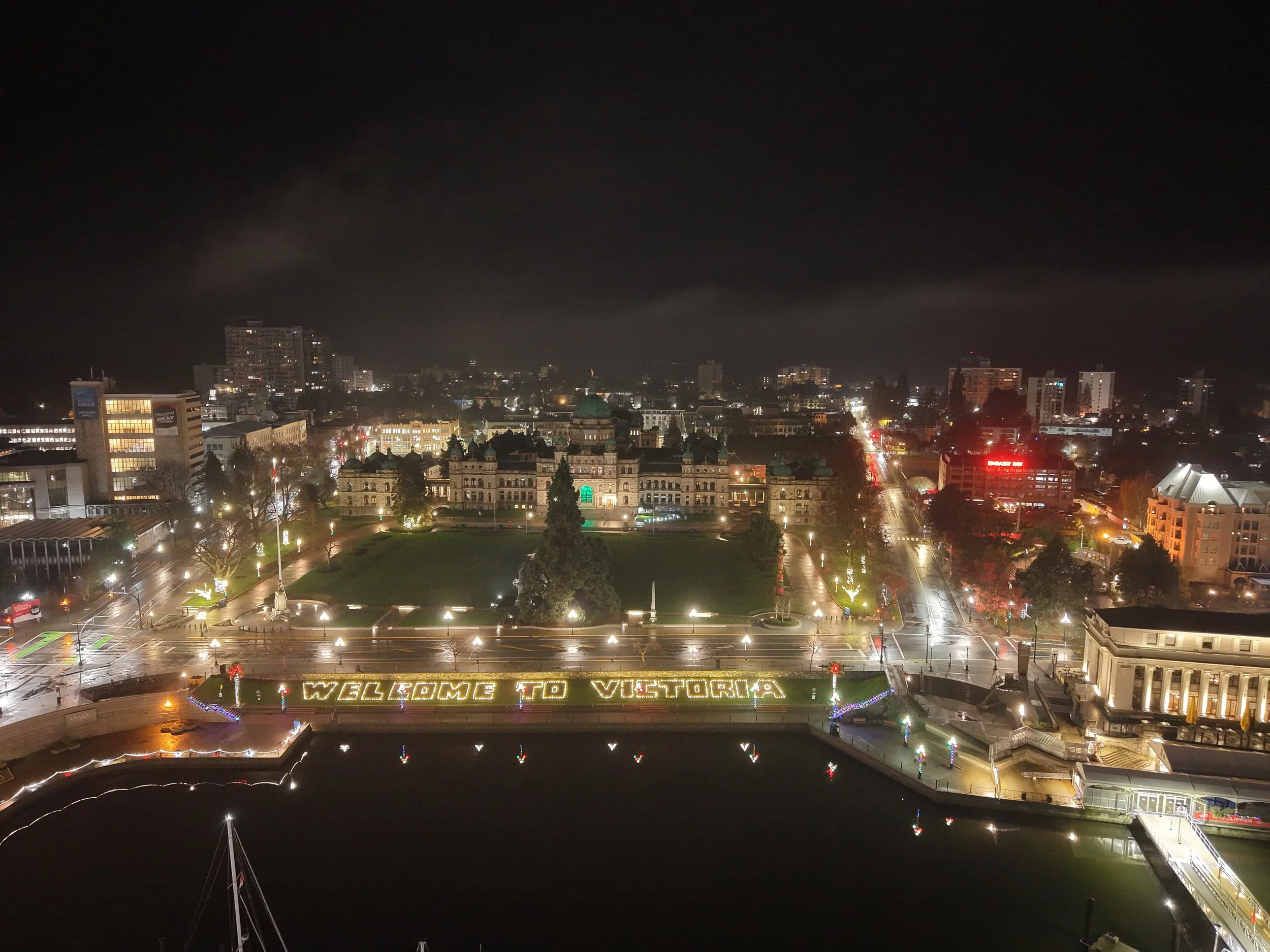 A calm, misty night over Victoria’s Inner Harbor, captured from above.