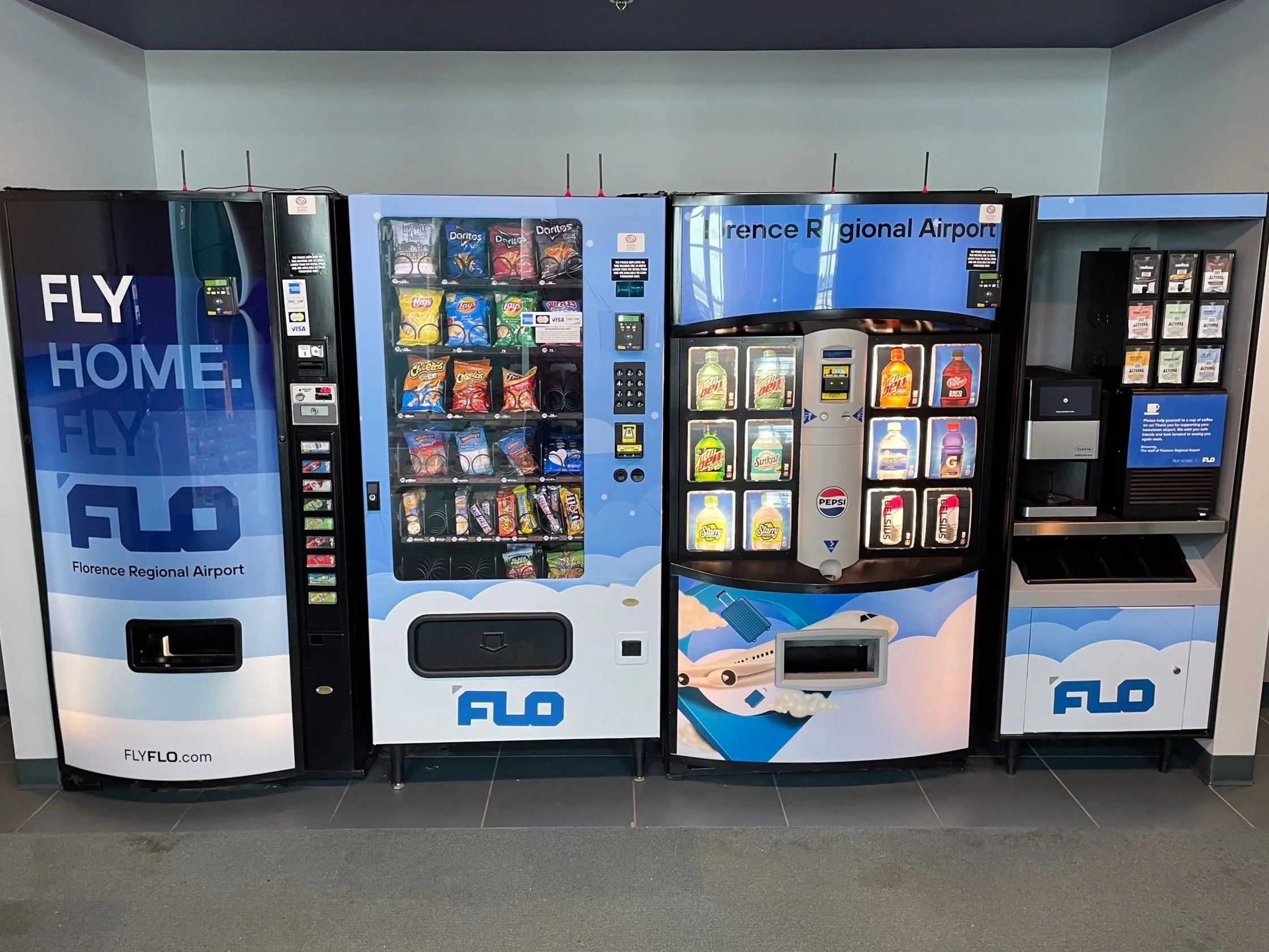 Vending machines at Florence Regional Airport, including snack, drink, and coffee vending machines.
