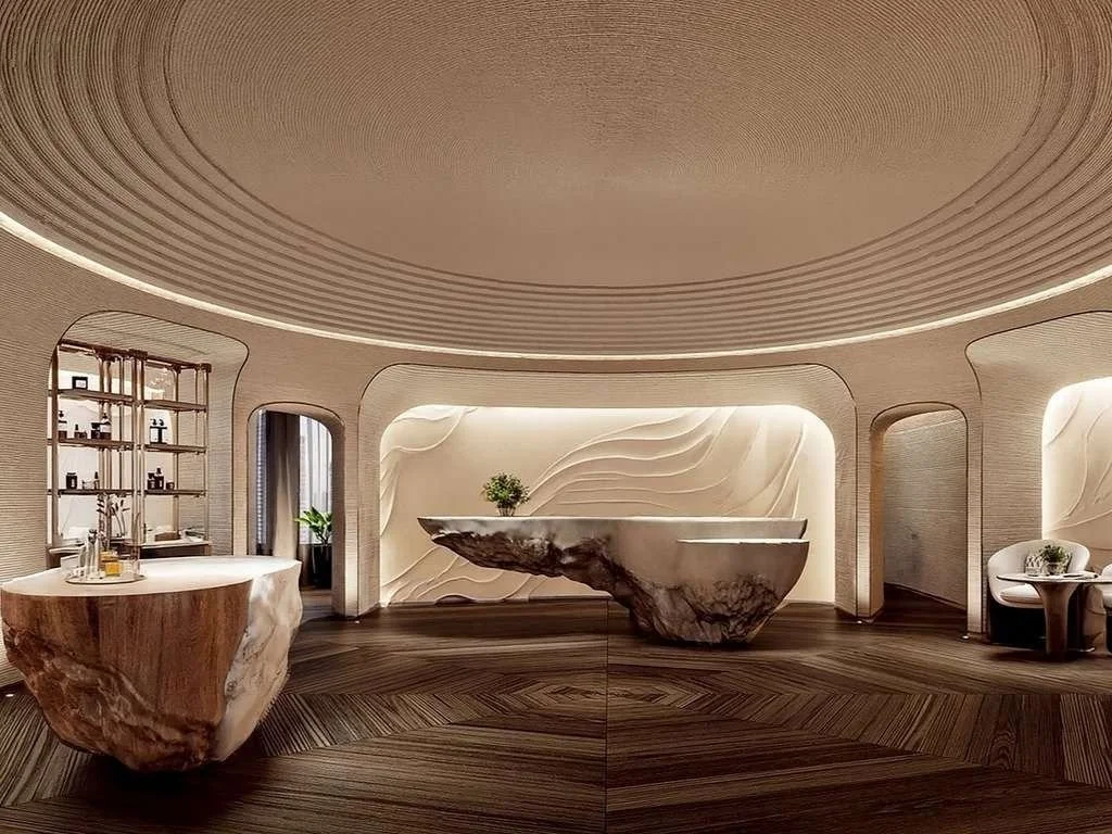 Modern interior with sculptural wooden tables, a textured wall, and ambient lighting.