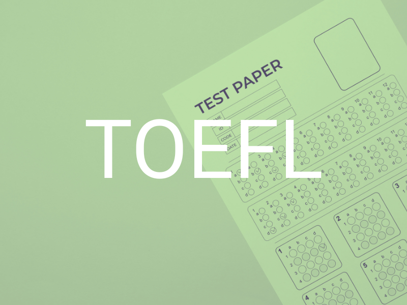 A standardized test answer sheet with multiple-choice bubbles and a form labeled 'Test Paper,' overlaid with large white text that reads 'TOEFL'.