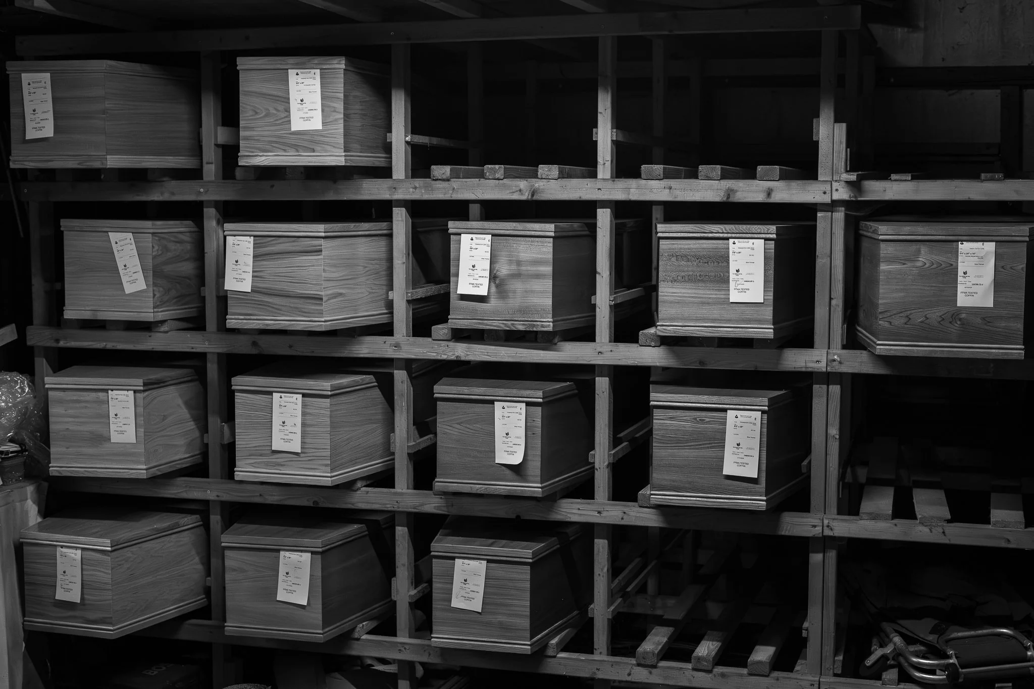 Wooden boxes stored on wooden shelves in a warehouse
