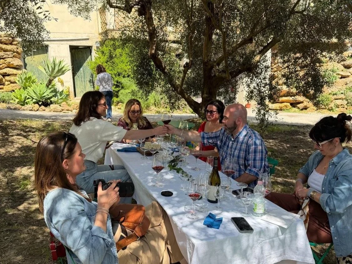 Sicily_LongTable_Group_Toast_OliveTrees.jpg