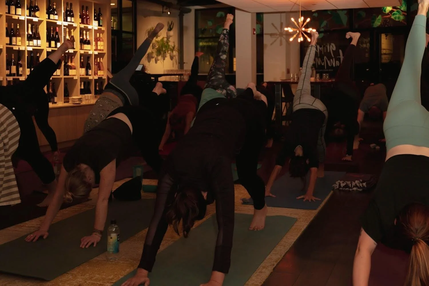 image of women doing yoga in a wine cellar