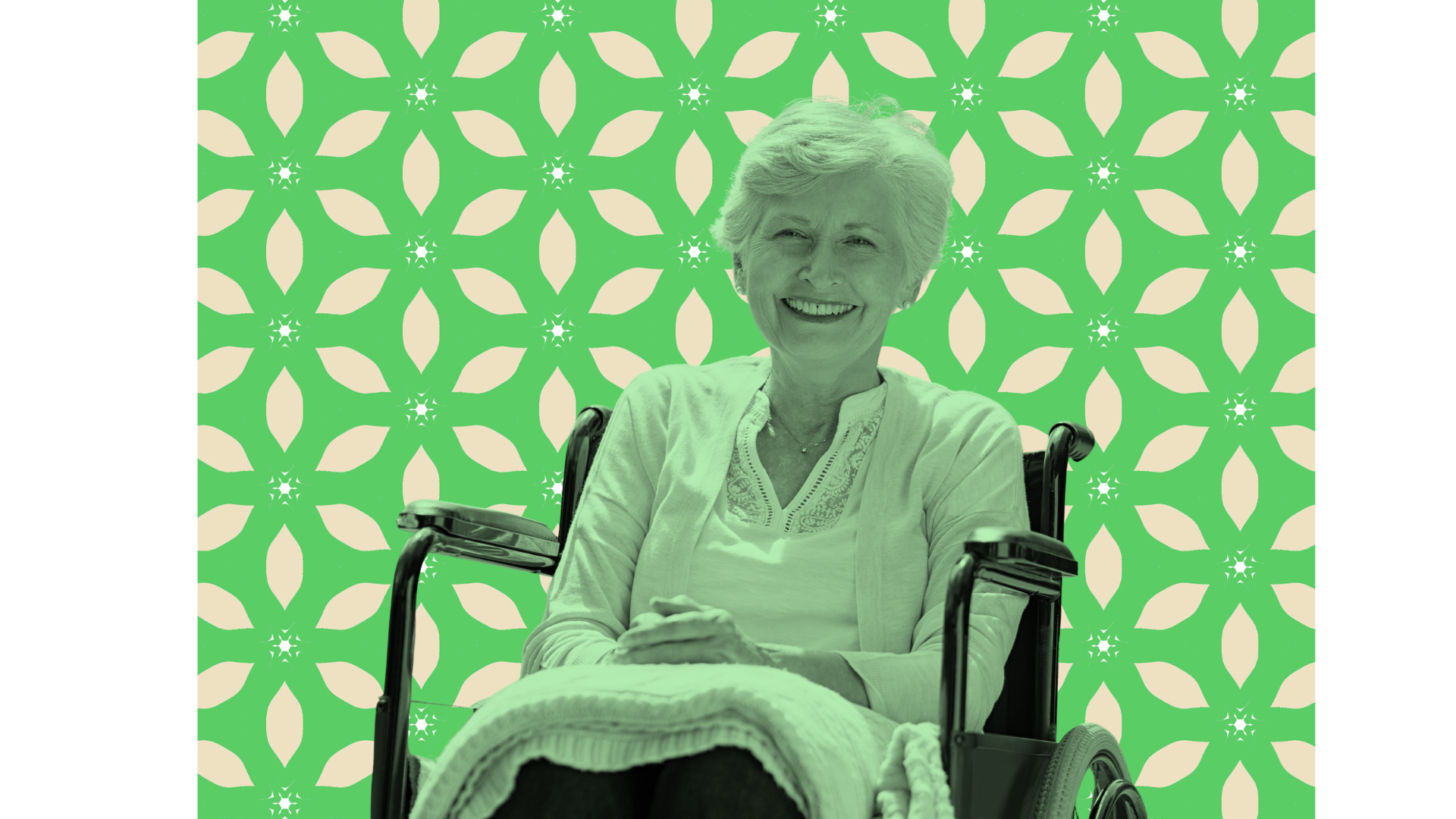 A smiling elderly woman with short white hair sitting in a wheelchair, wearing a light-colored blouse, against a decorative green and cream patterned background.