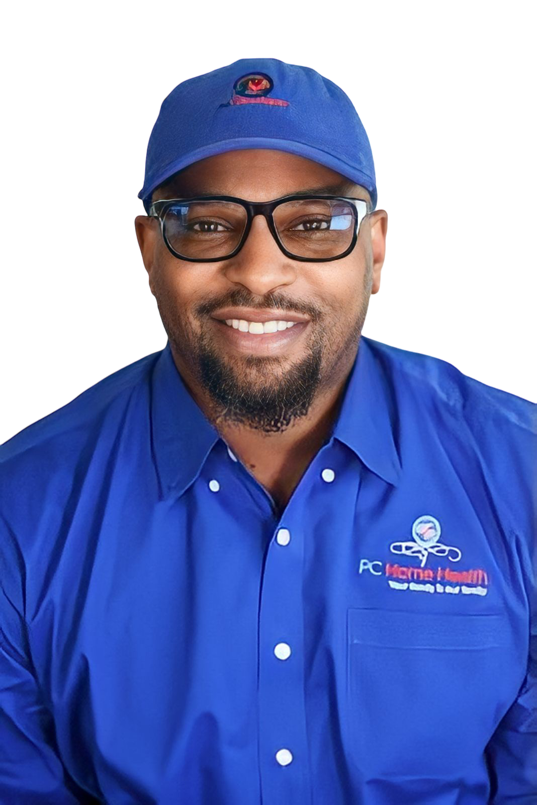 A smiling man wearing glasses, a blue baseball cap with a logo, and a blue button-up shirt with a logo and text that reads 'PC HCITMA Healthcare'.