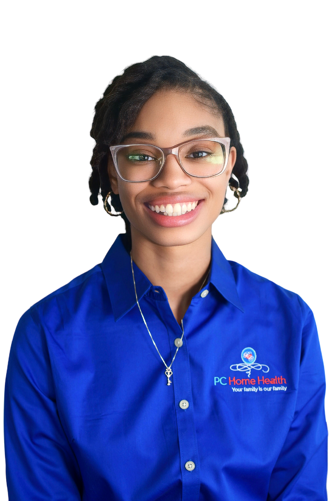 A young woman with glasses and a bright smile wearing a blue shirt with 'PC Home Health' logo and slogan, standing against a plain background.