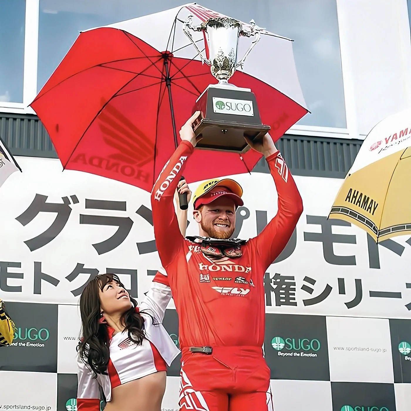 trey-canard-sugo-japan-podium-victory-honda-trophy-raise.jpg