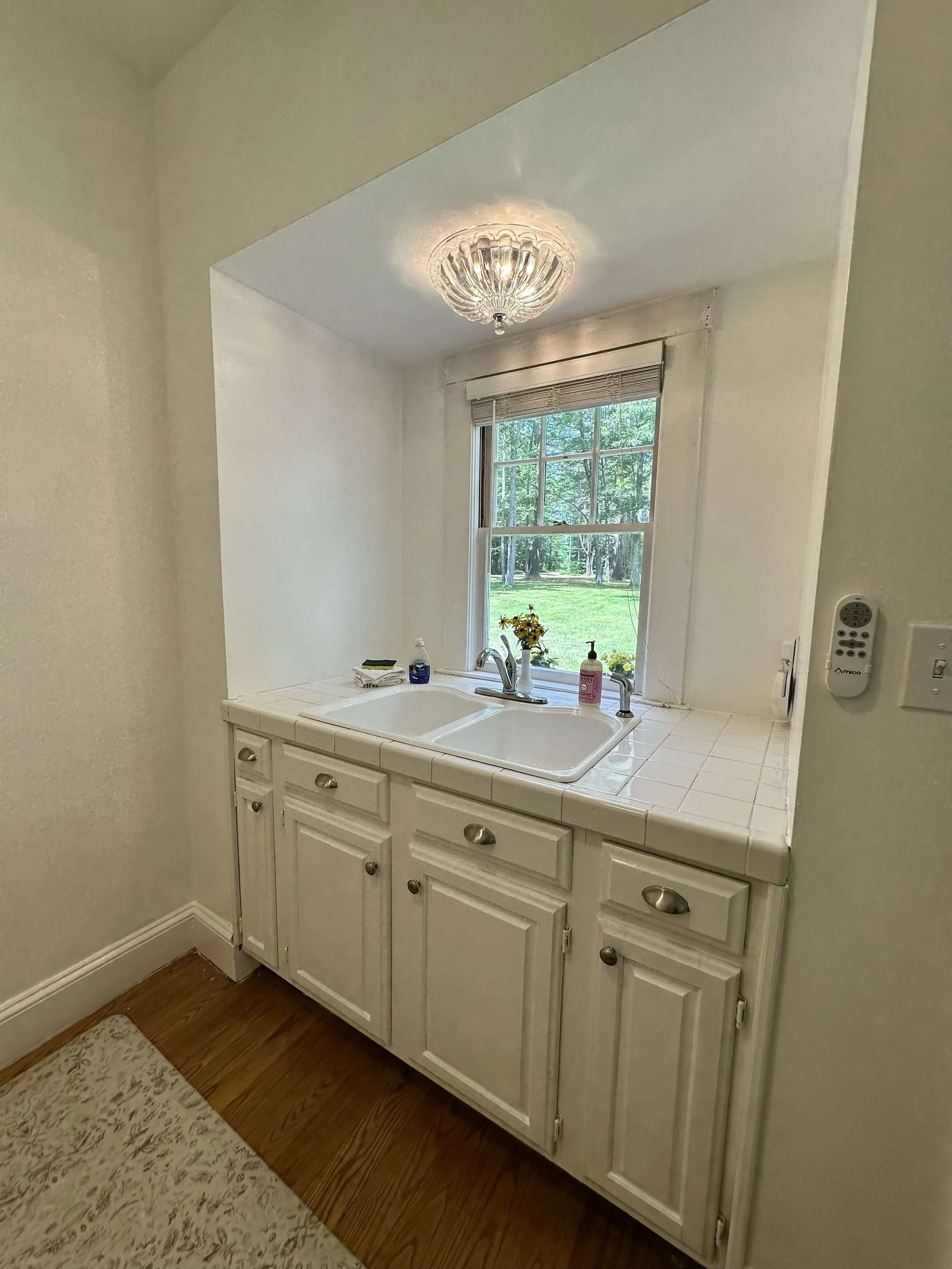 Light filled kitchen Elizabeth Cottage Historic Lakefront Vacation Home Belgrade Lakes Maine.jpg