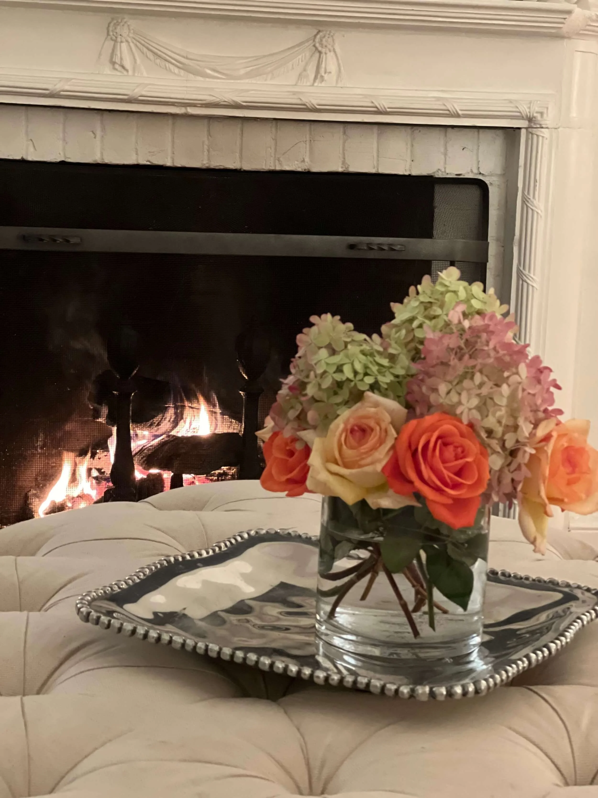 Flowers and fireplace at La Posa Estate
