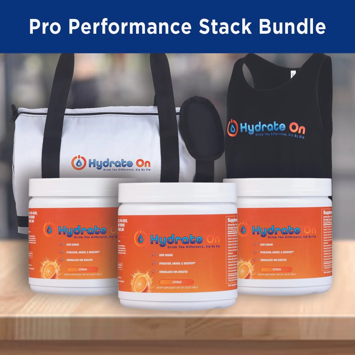 Pro Performance Stack Bundle featuring three containers of Hydrate On with orange citrus flavor, a white and black hydration bag with the Hydrate On logo, and a black hydration tote with the Hydrate On logo on a wooden surface.