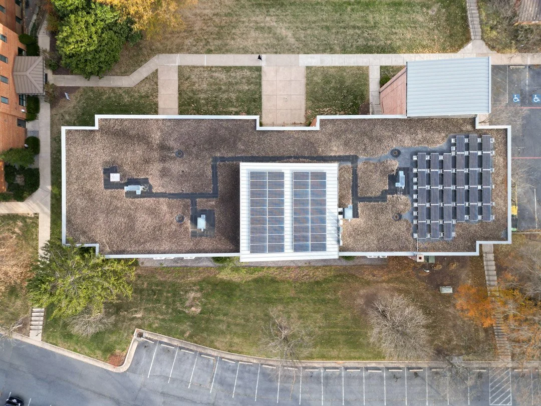 Drone view from above of Commercial Solar PV array on Eastern Mennonite University Roselawn roof.