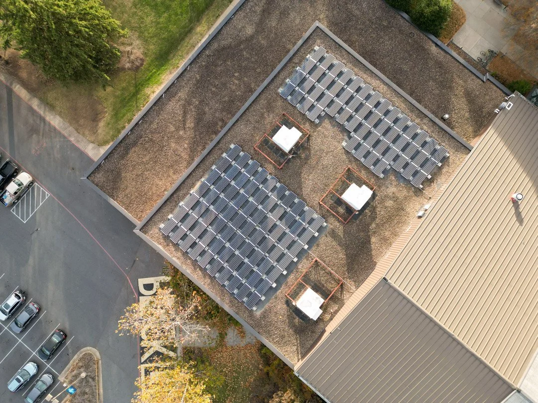 Drone view from above of Commercial Solar Panel array on Eastern Mennonite University Commons roof.