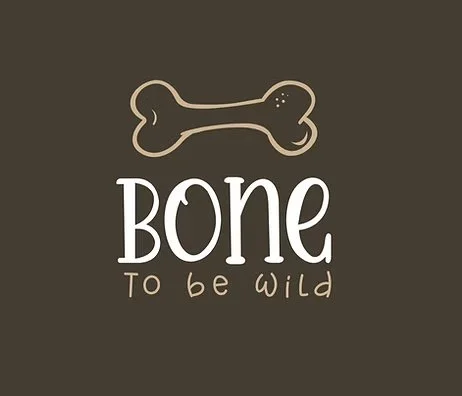 A brown background with a simple illustration of a dog bone and the text 'Bone to be wild' in white and beige fonts.