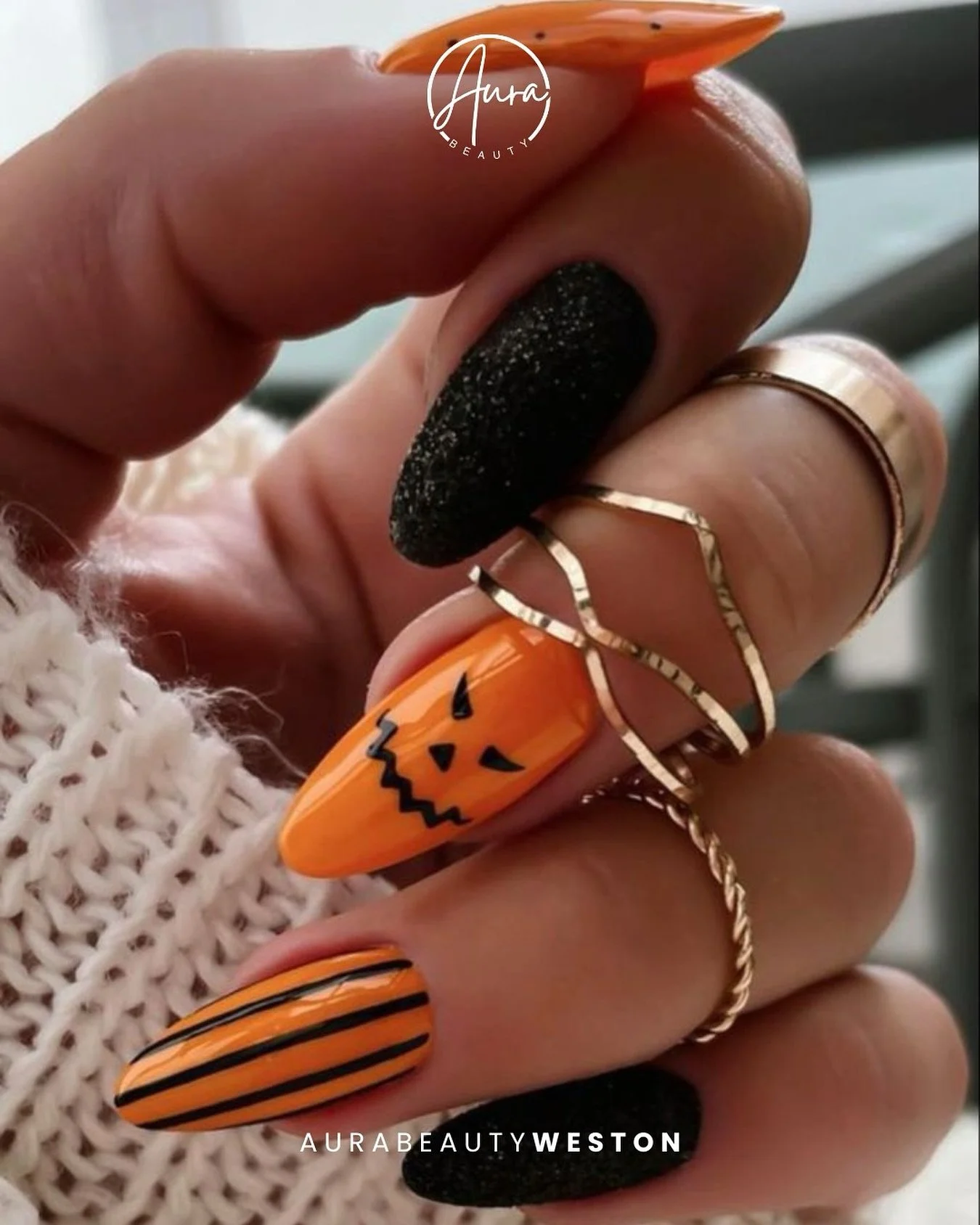Spooky, chic, and ready to steal the spotlight. 🖤🎃

This Halloween nail set brings just the right mix of glam and edge &mdash; bold orange, sleek black, and a touch of playful fright.

Book your festive mani at Aura Beauty Weston &mdash; spooky sea