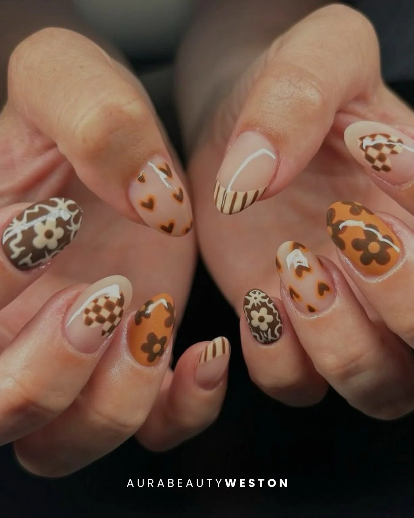 A mix of hearts, florals, checker details, and warm caf&eacute; tones that feel like sweater weather on your fingertips.

Ready for your own dreamy seasonal set? Book your next appointment at Aura Beauty Weston 💅