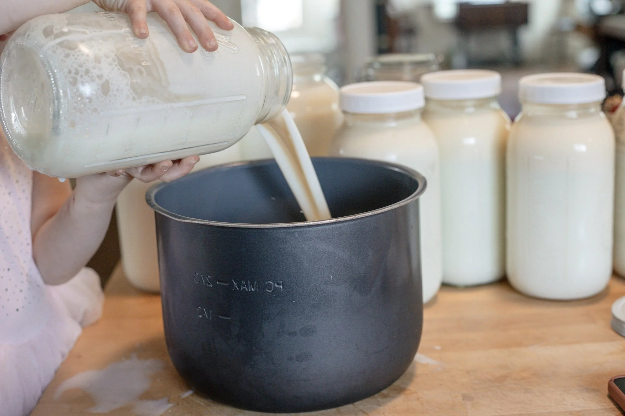pouring raw milk into an instant pot