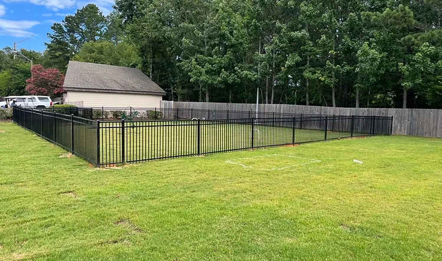 Steel fence builders installing durable metal fencing in Madison MS