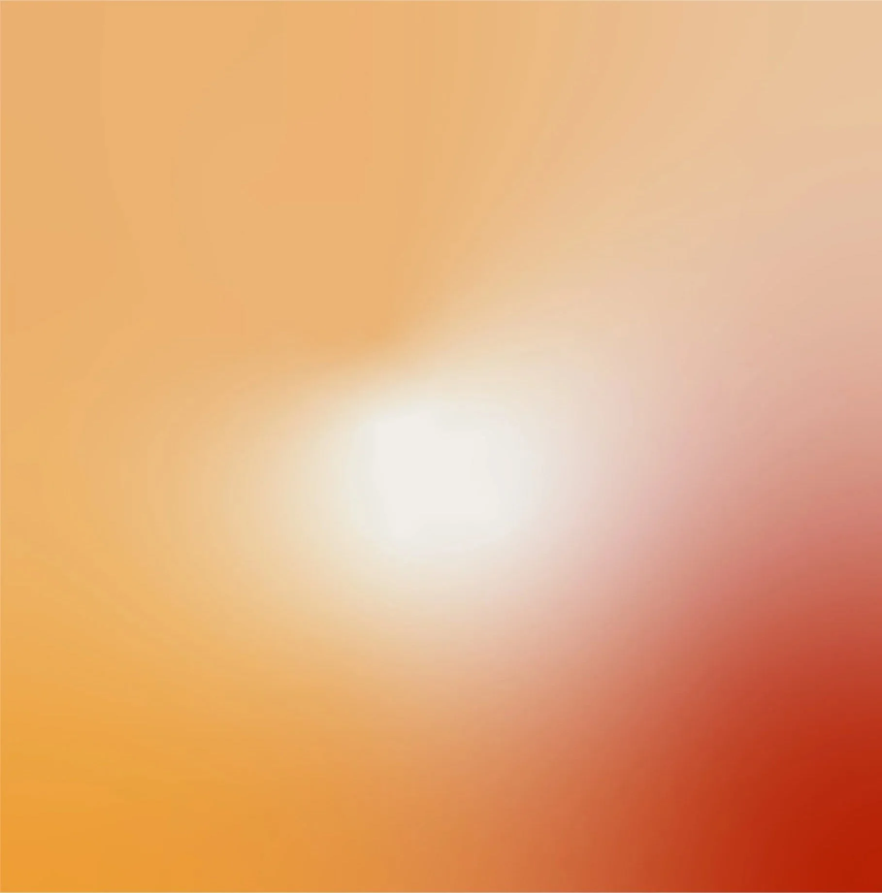 An abstract blurred image with warm colors, including orange, red, and yellow, and a bright white light in the center.