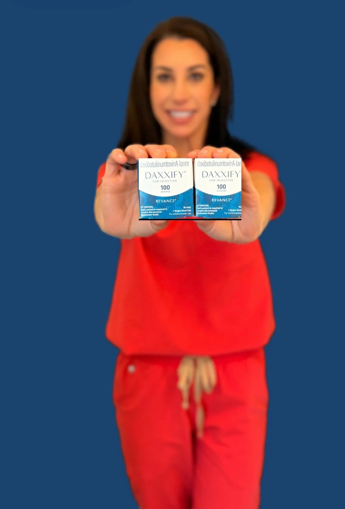 Mandy Patz-Beam, owner of Forever Beaming med spa, holding up 2 packages of Daxxify dermal filler.