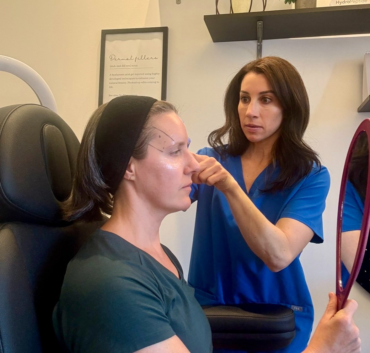 Mandy Patz-Beam administering a medical aesthetics treatment with a client in Peoria, Arizona.