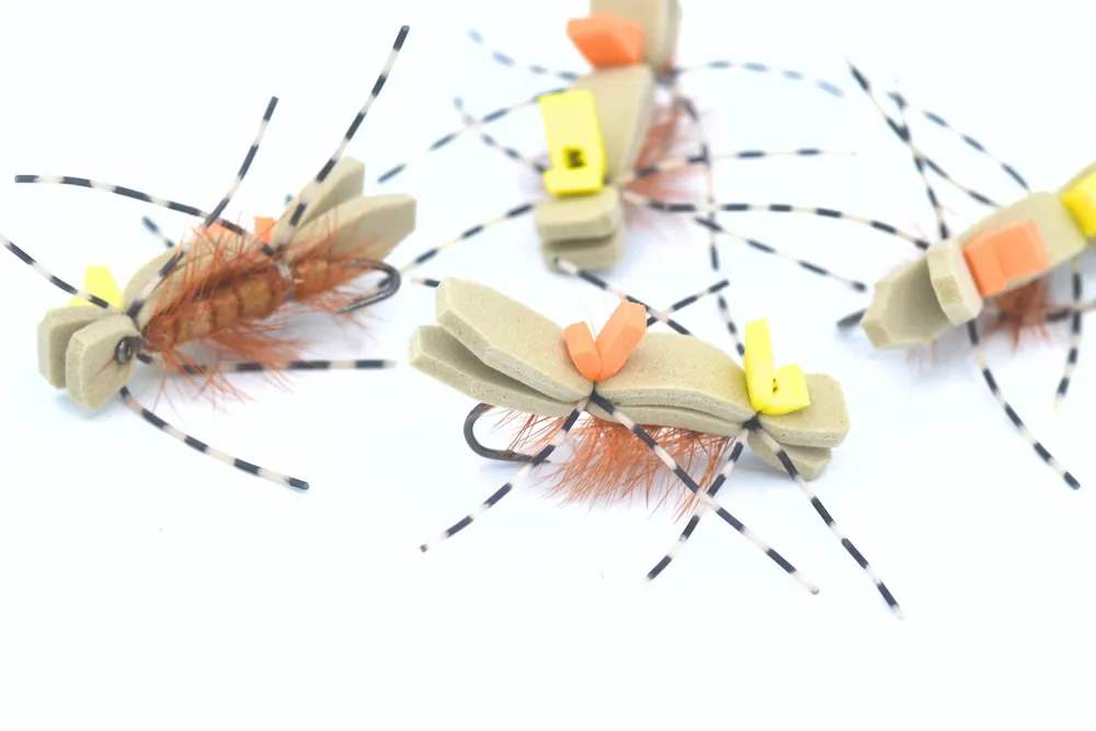 Large Chernobyl Ant dry flies with foam bodies and rubber legs for trout fishing.