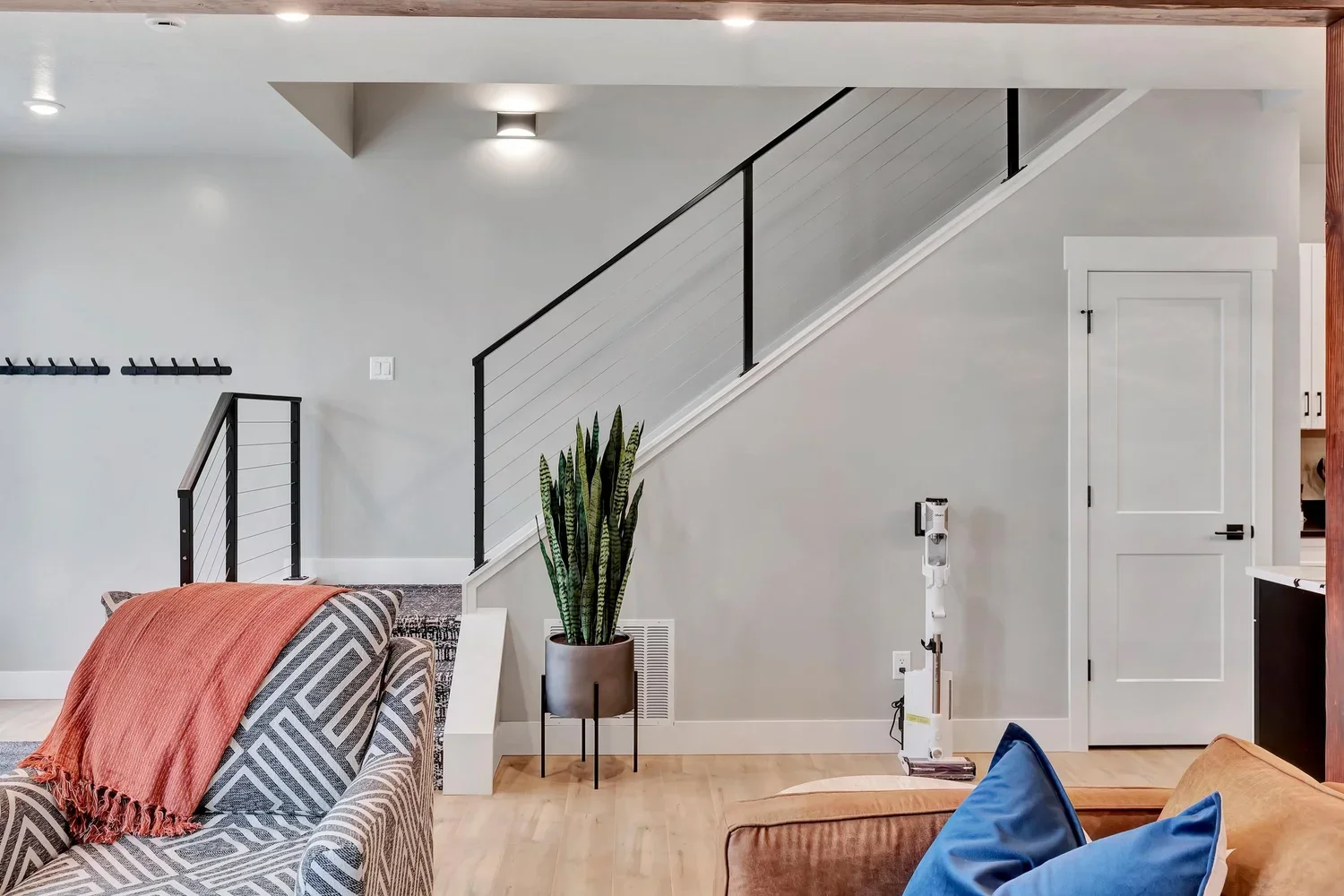 cozy-living-room-and-staircase.webp