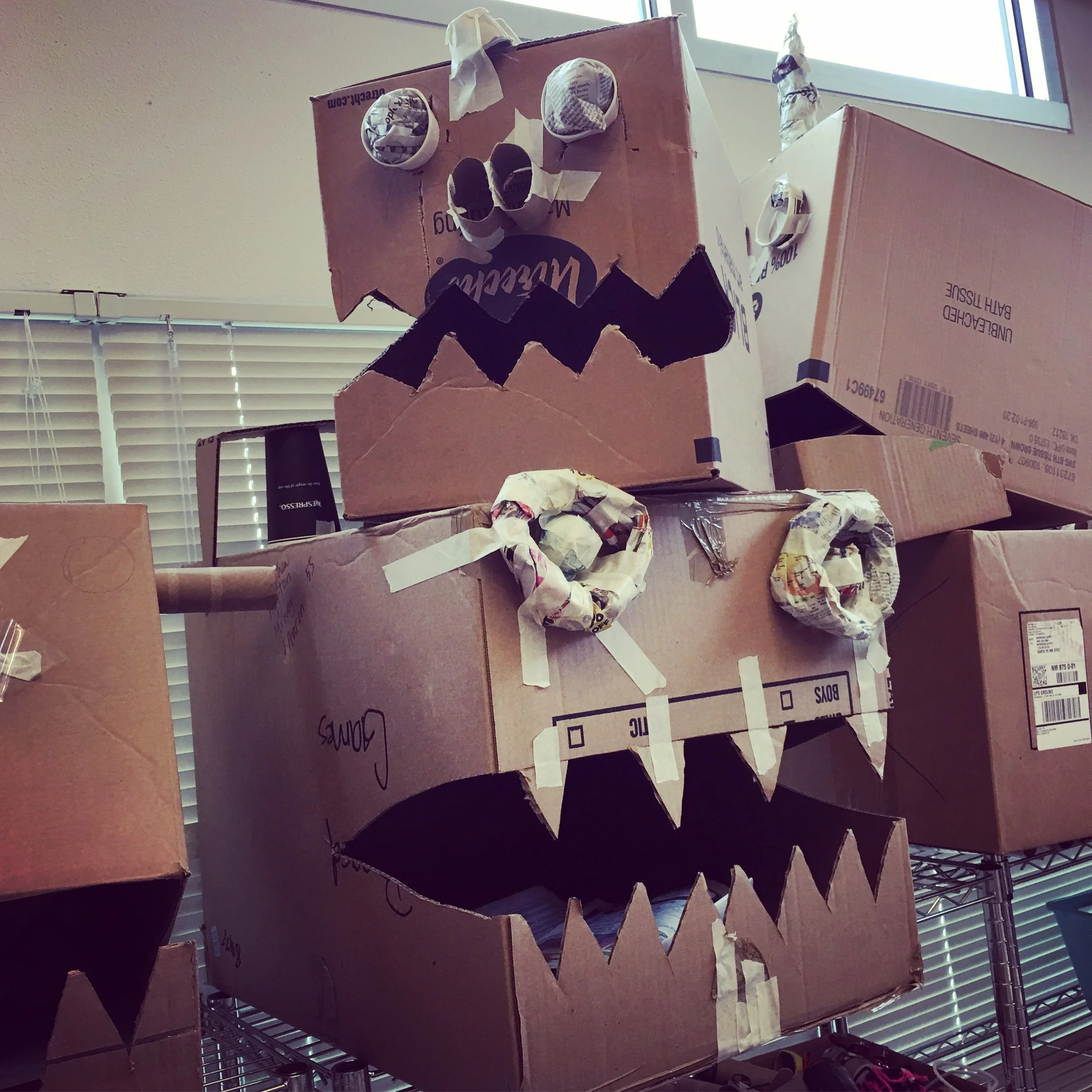 Box head dragons in process in elementary classroom.