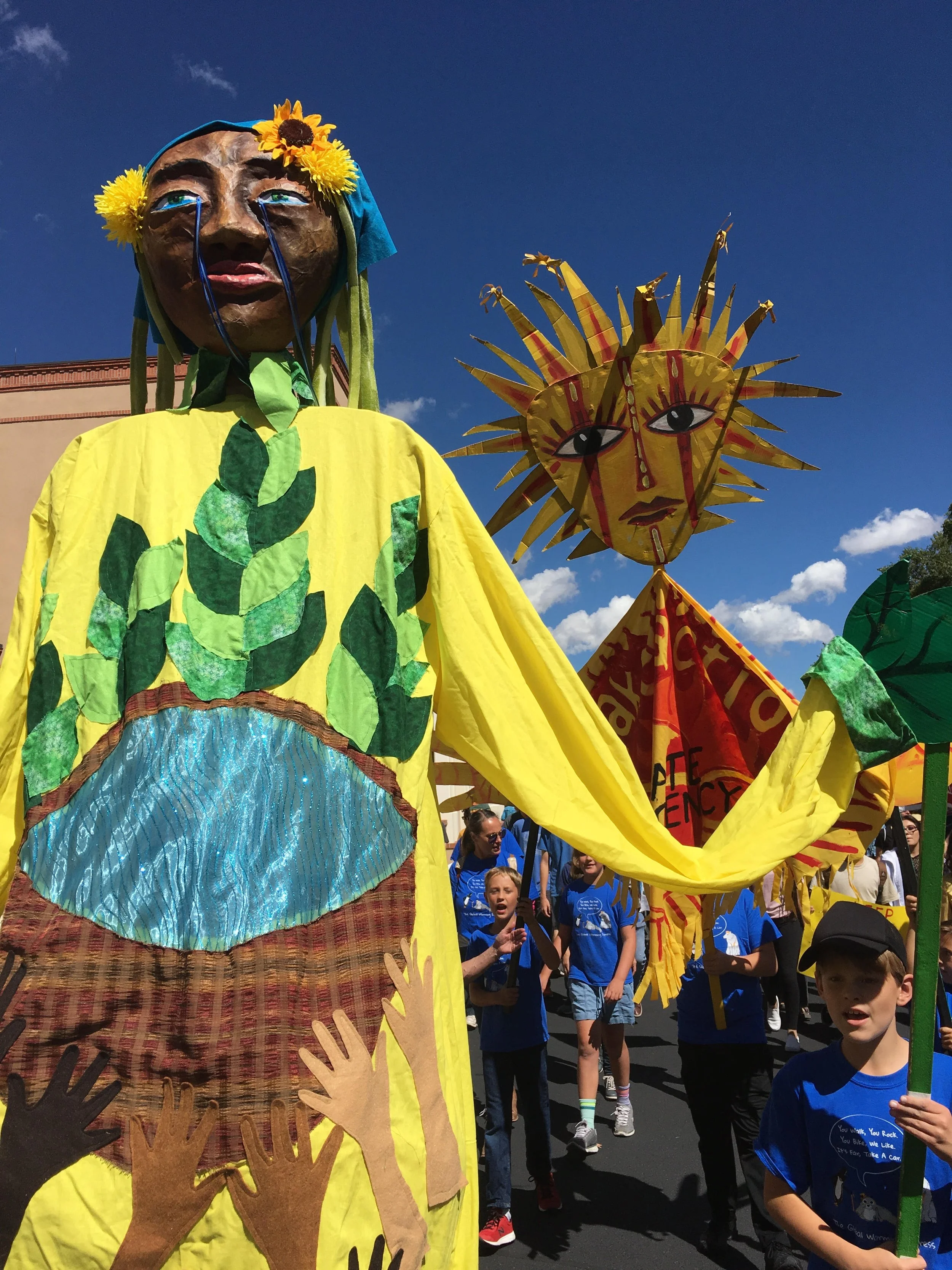 Youth created "Burden and Bounty" puppet at youth-led climate justice march, NM Roundhouse, 2023.
