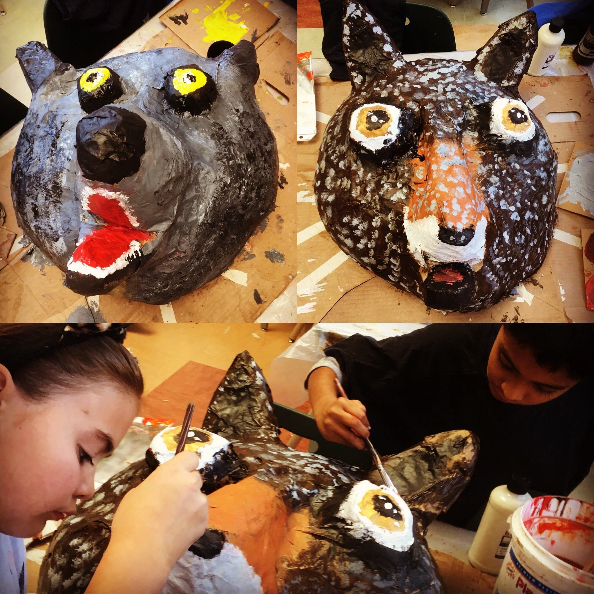 Elementary school youth working on giant puppet animal masks created as part of "local species" curriculum.